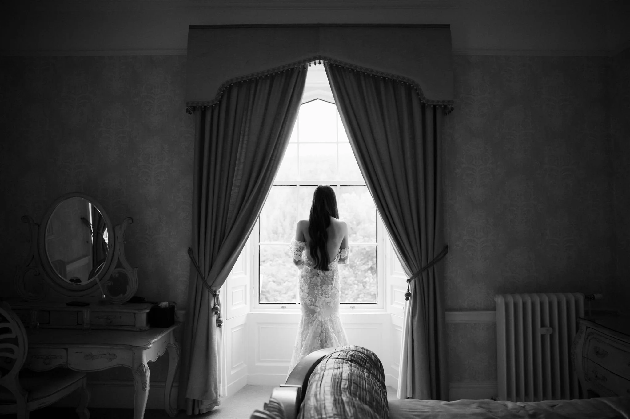 A luxury castle bride on a wedding day at Drumtochty Castle in Scotland.