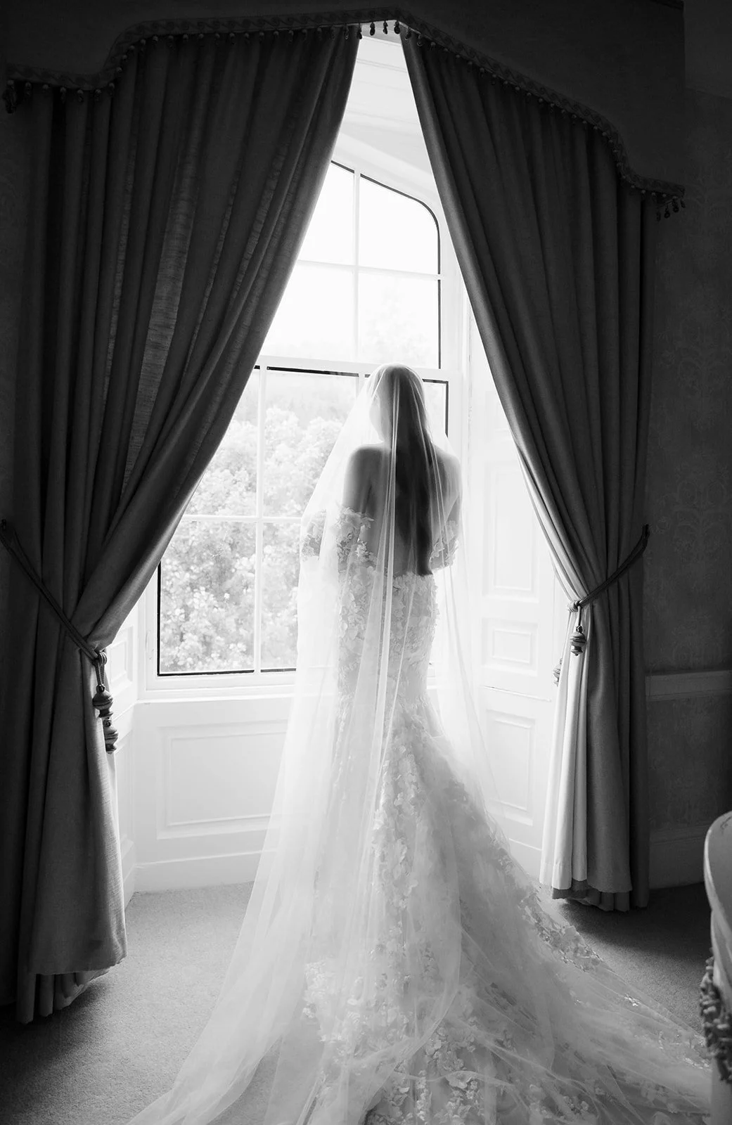 A luxury castle bride on a wedding day at Drumtochty Castle in Scotland.