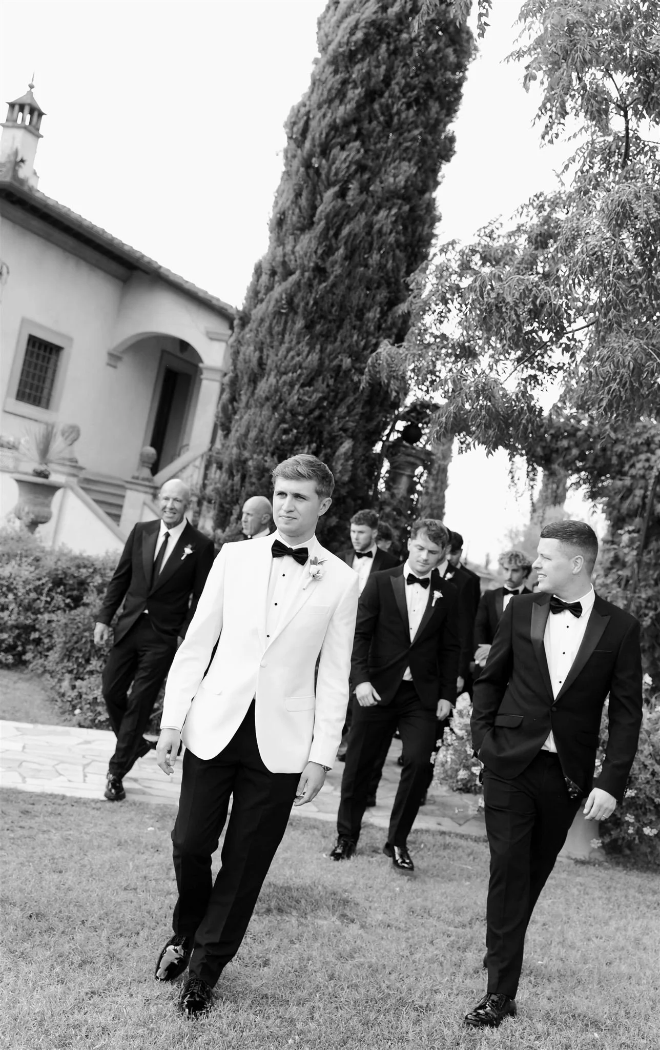 Groom and groomsmen on a wedding day at Tenuta Corbinaia Villa in Tuscany, Italy.