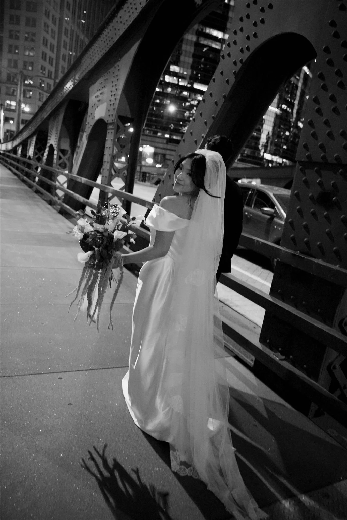 Bride and groom in downtown Chicago on the way to Gilt Bar.