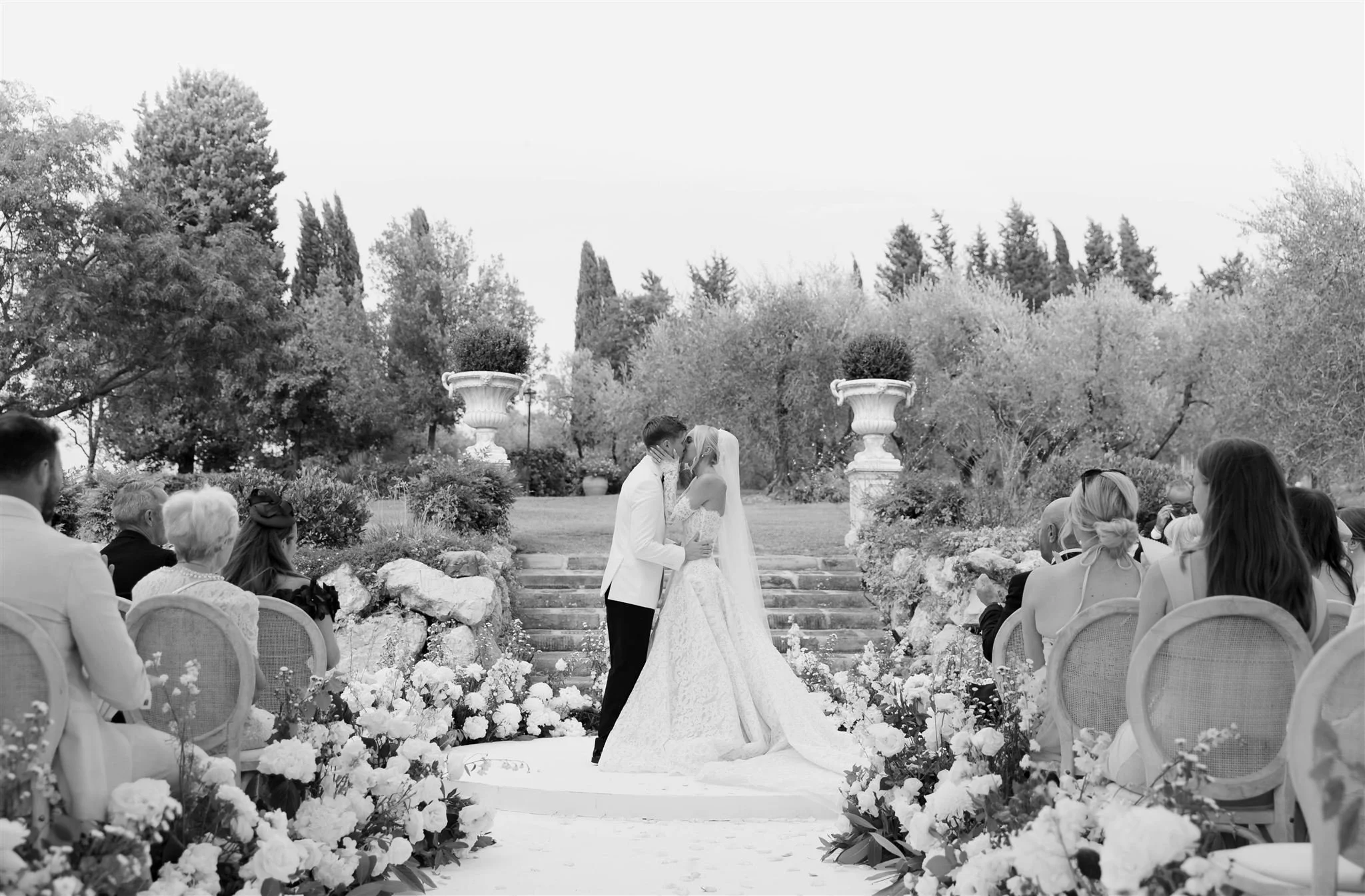 An outdoor wedding ceremony at Tenuta Corbinaia Villa in Tuscany, Italy.