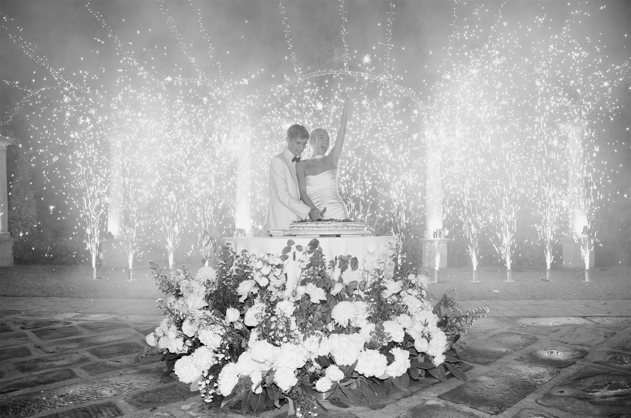 An italian cake cutting on a wedding day at Tenuta Corbinaia Villa in Tuscany, Italy.