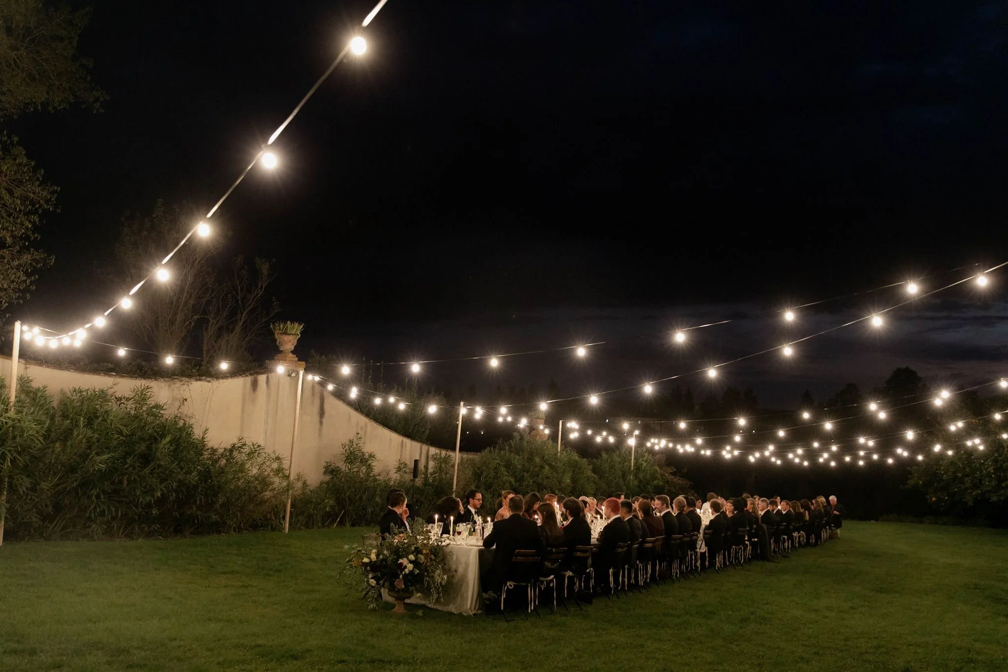 Garden wedding reception on a wedding day at Villa Medicea Di Lilliano in Tuscany, Italy.