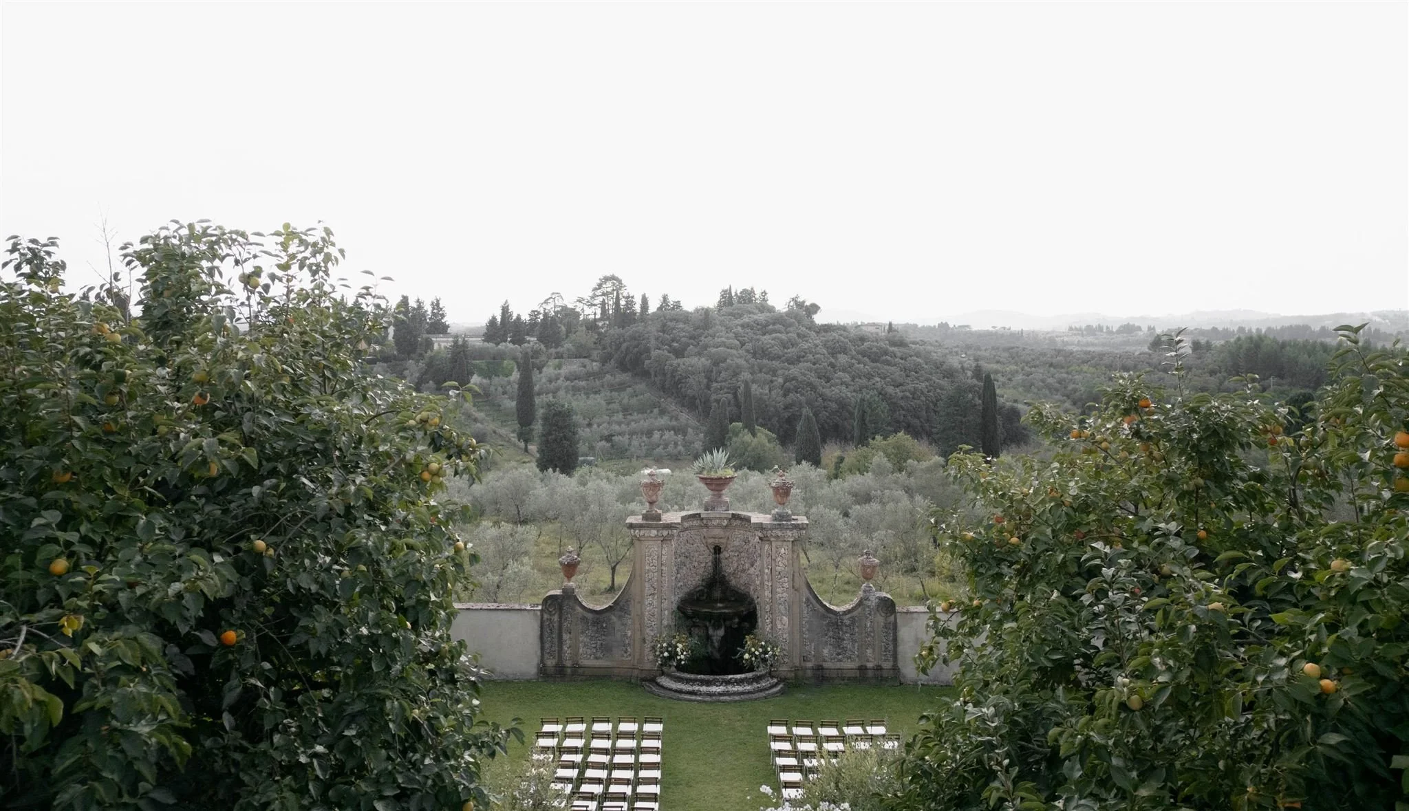 Garden Wedding Ceremony on a wedding day at Villa Medicea Di Lilliano in Tuscany, Italy.