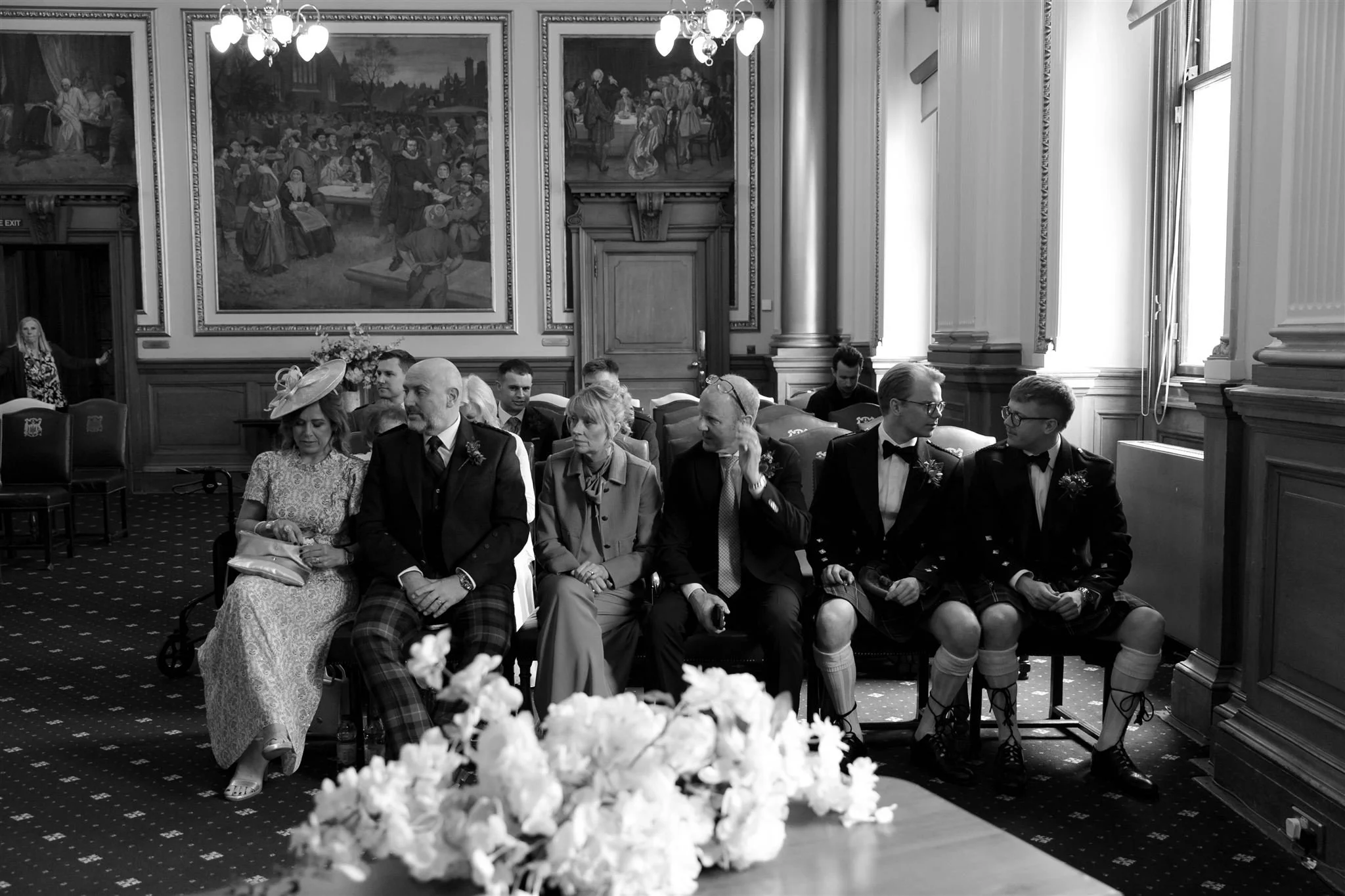 Wedding guests on a wedding day at Edinburgh City Chambers, photographed by an Edinburgh Scotland Wedding Photographer..