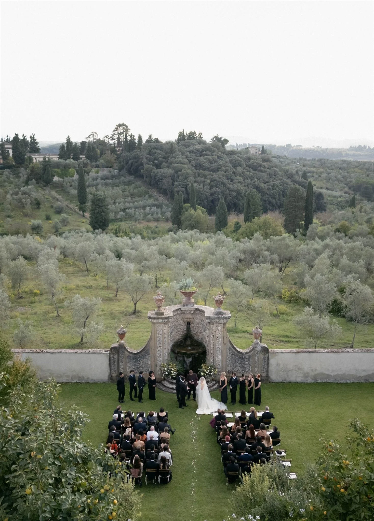 Garden Wedding Ceremony on a wedding day at Villa Medicea Di Lilliano in Tuscany, Italy.