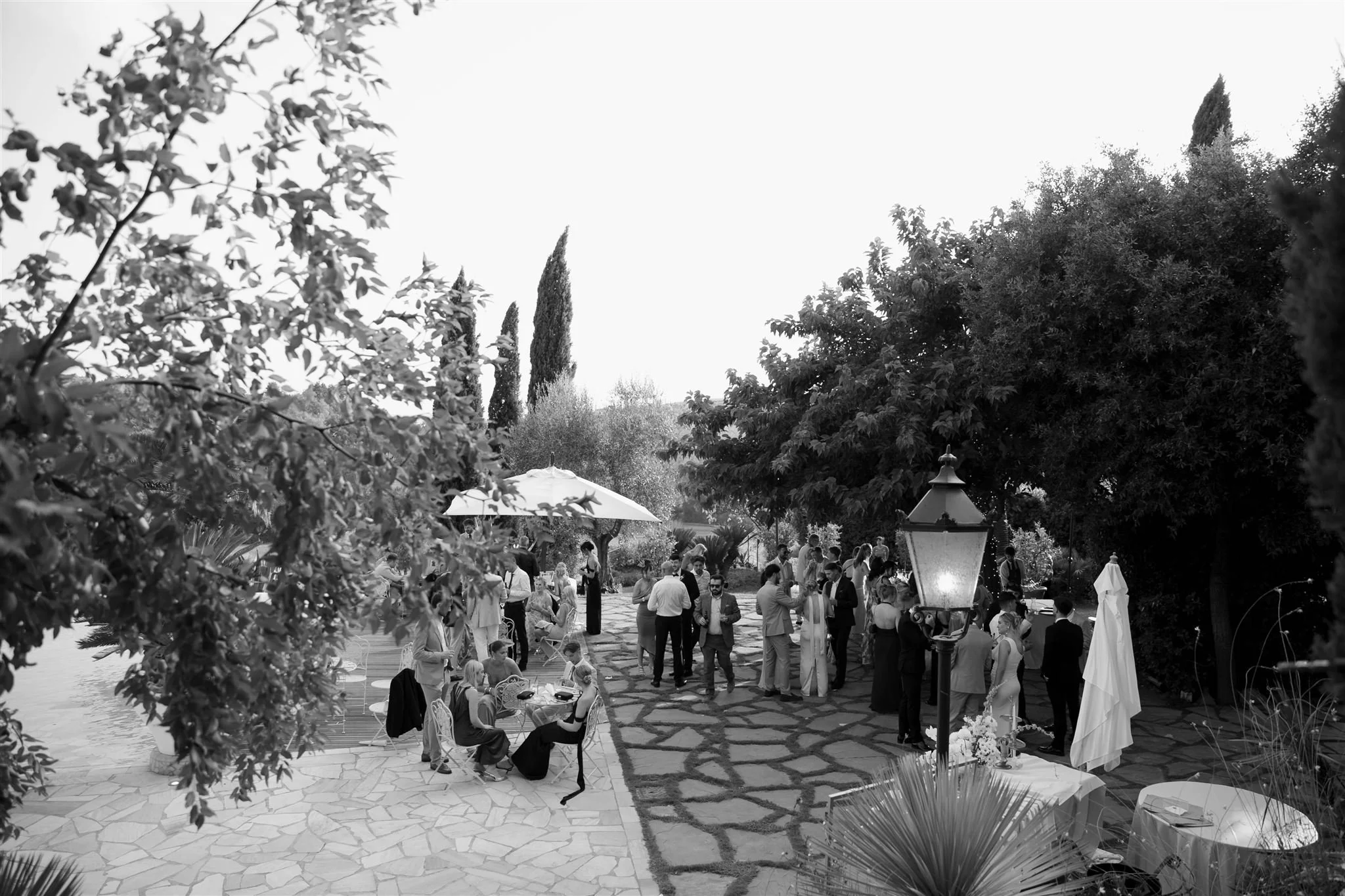 A poolside cocktail hour on a wedding day at Tenuta Corbinaia Villa in Tuscany, Italy.