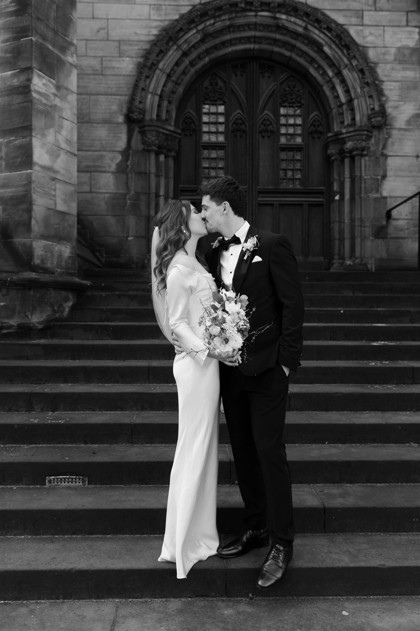 Wedding couple celebrating in Edinburgh after their City Chambers ceremony.