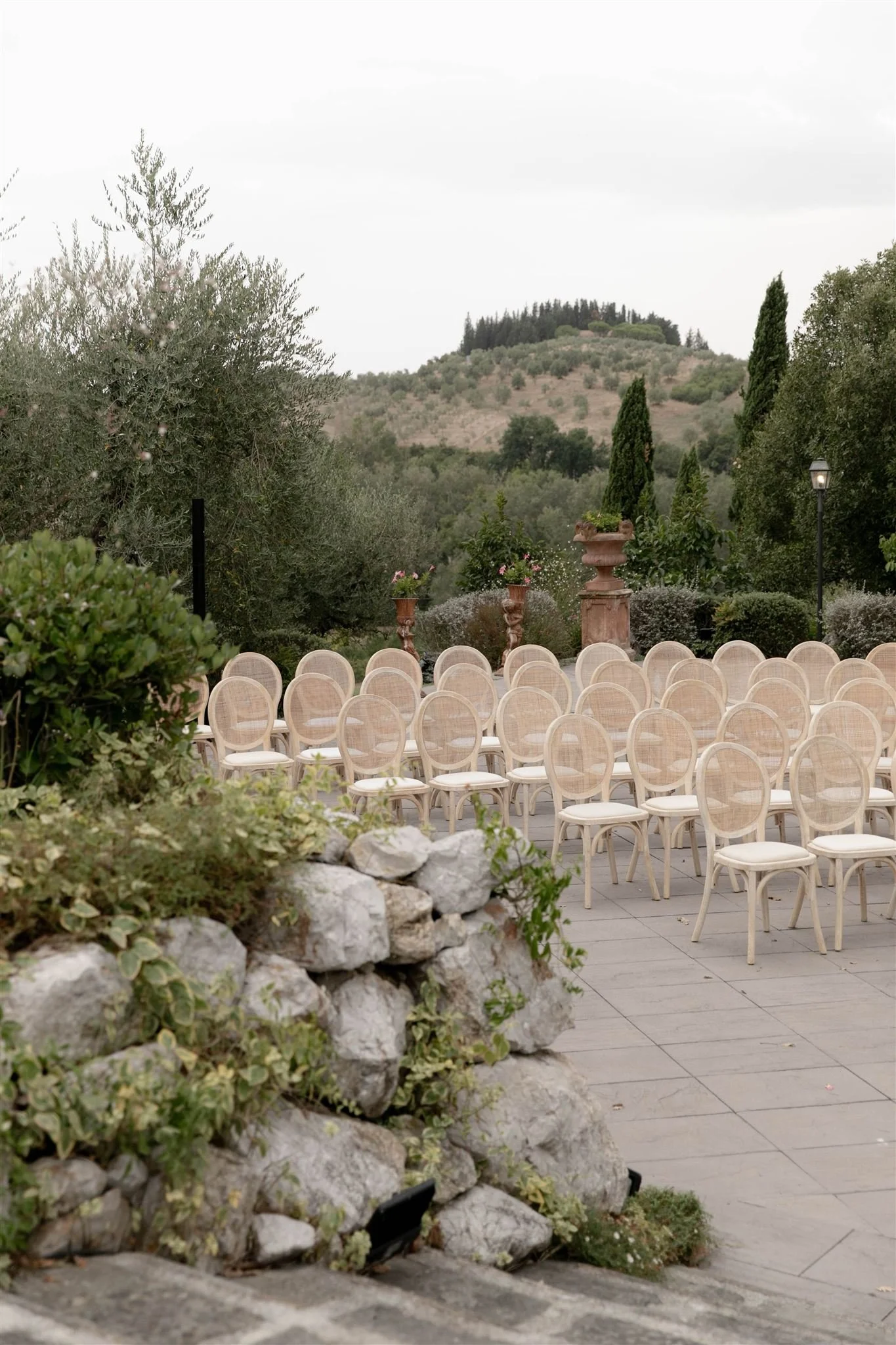 An outdoor wedding ceremony at Tenuta Corbinaia Villa in Tuscany, Italy.