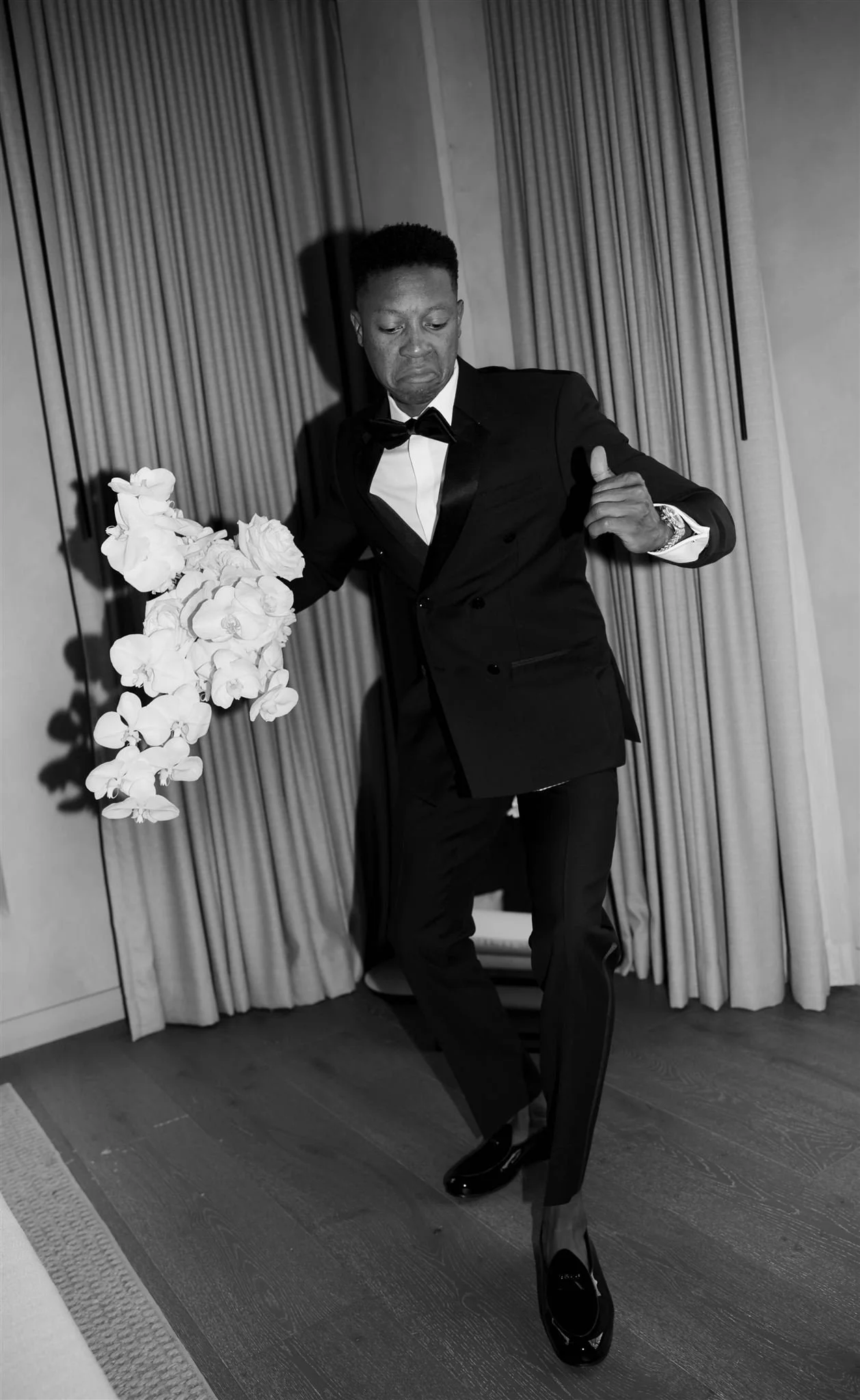 Groom with wedding bouquet at Nobu Hotel on a wedding day in Chicago.