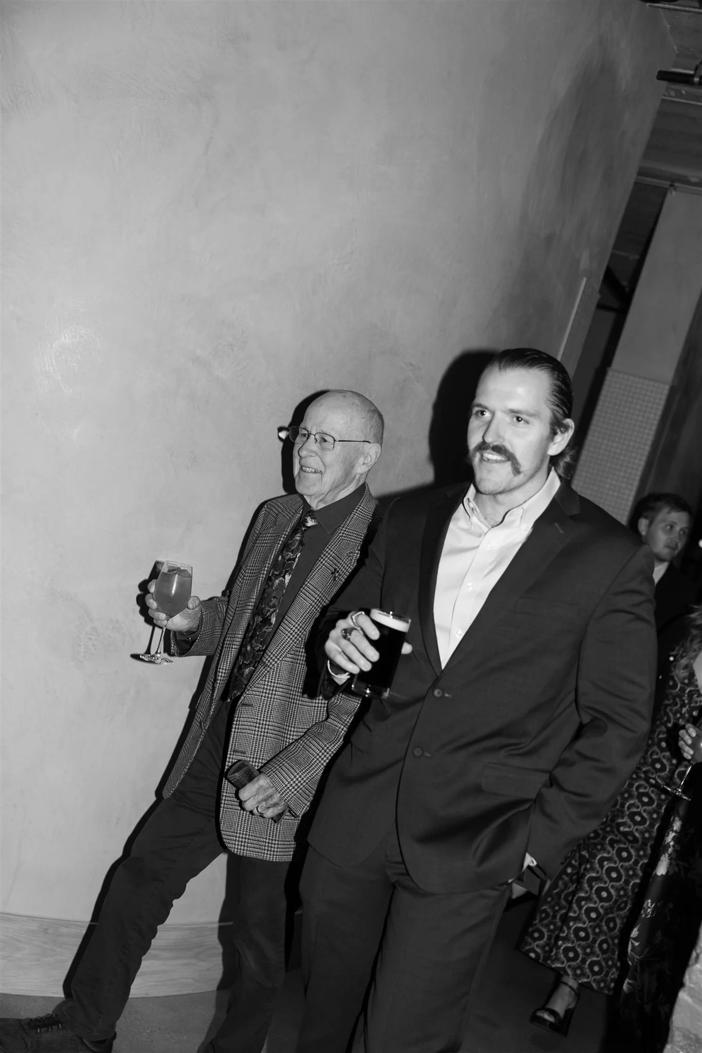 Wedding guests at a candlelit rehearsal dinner at Maxwells Trading Chicago wedding venue.