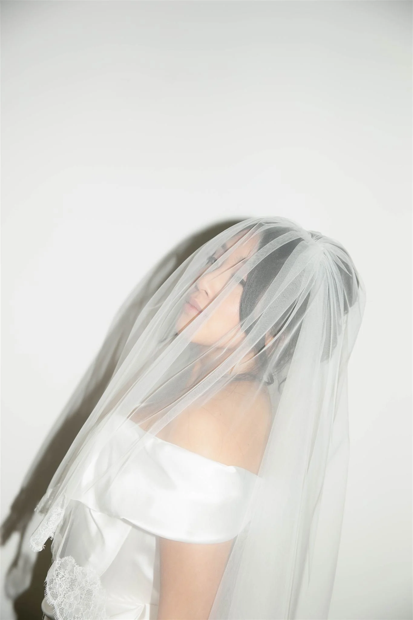 An editorial bridal portrait on her wedding day in Chicago.