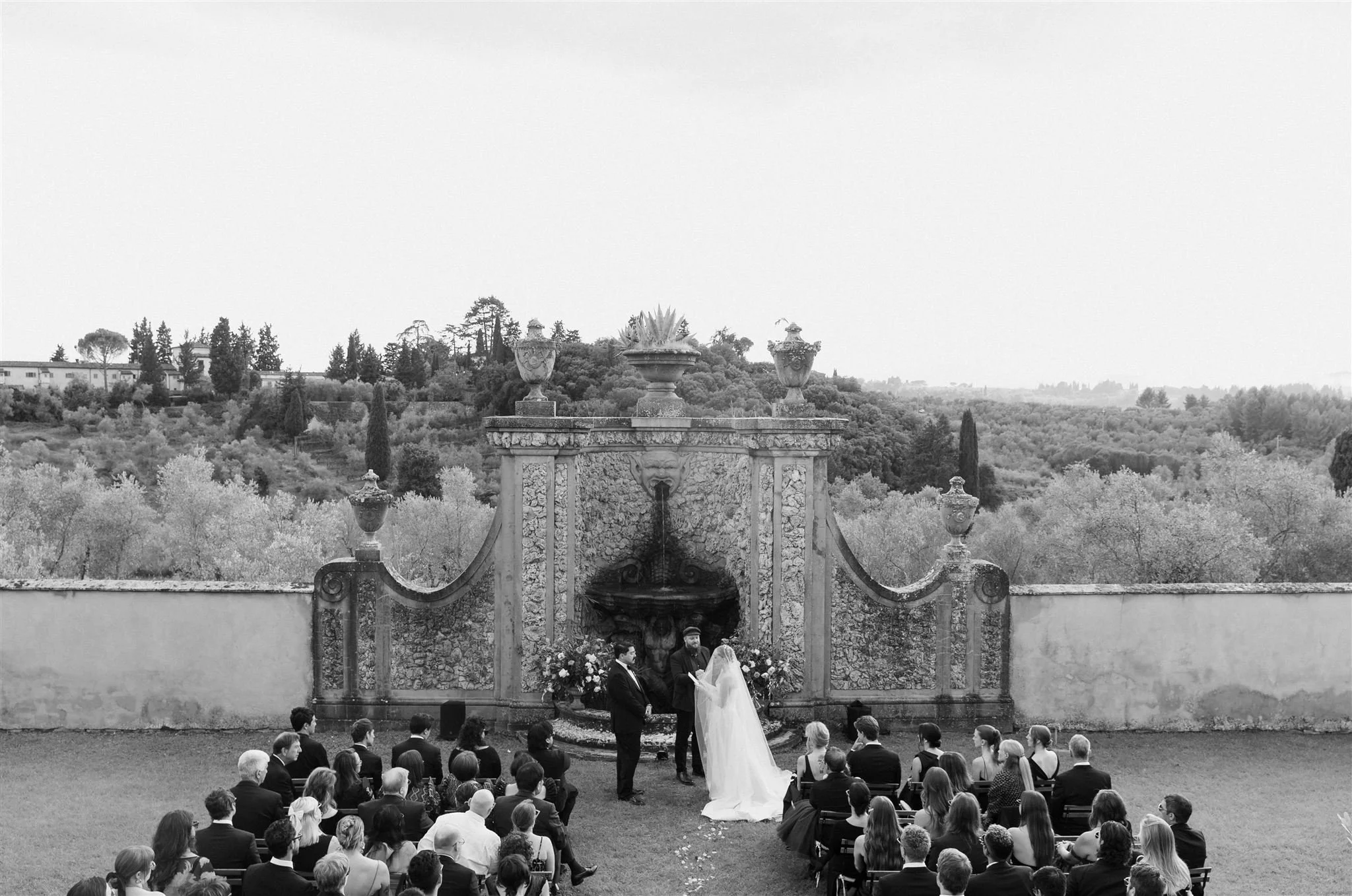 Garden Wedding Ceremony on a wedding day at Villa Medicea Di Lilliano in Tuscany, Italy.