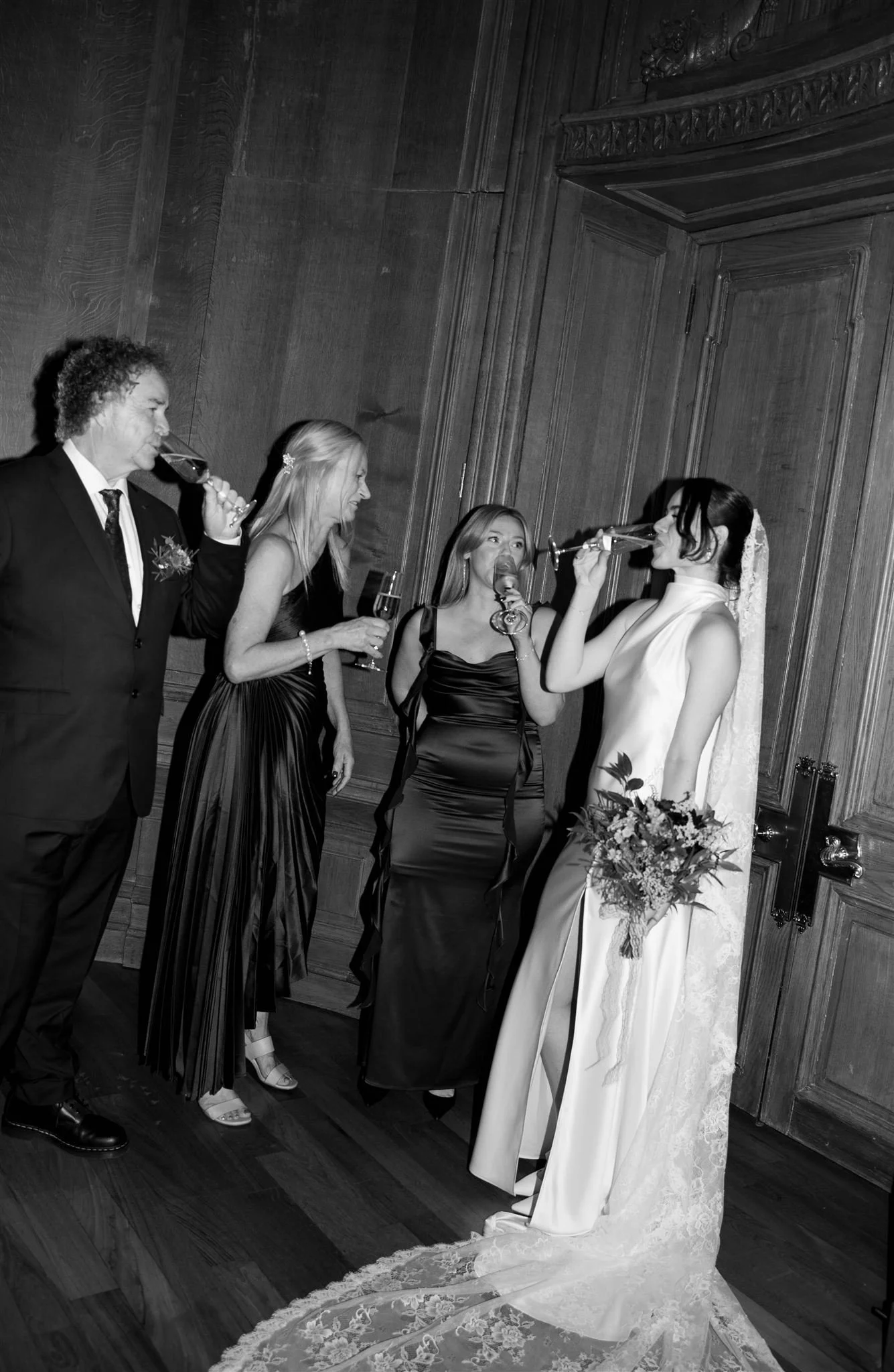 Bridesmaids drinking champagne photographed by an Edinburgh wedding photographer at The Edinburgh Grand Hotel.