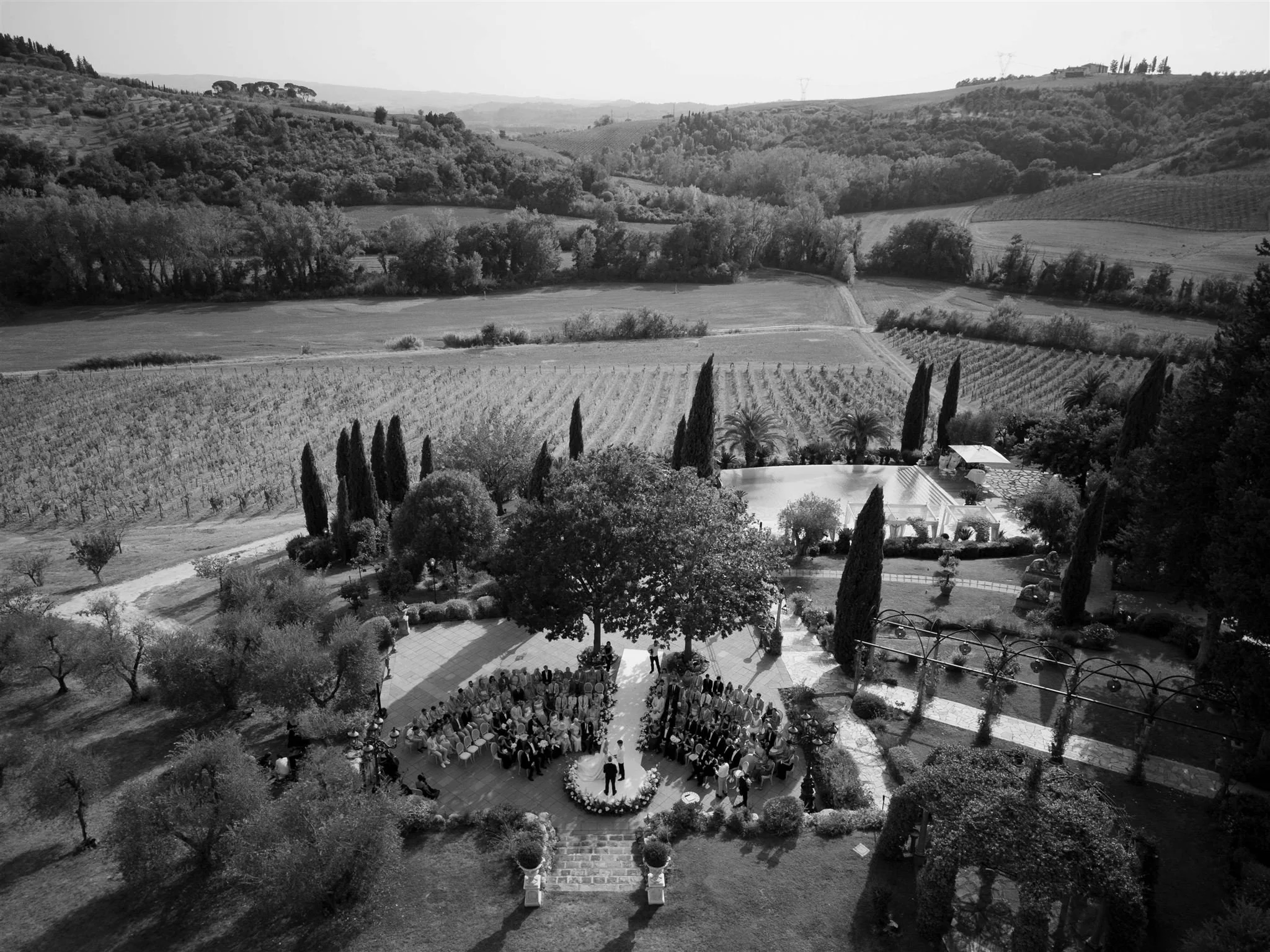 An outdoor wedding ceremony at Tenuta Corbinaia Villa in Tuscany, Italy.