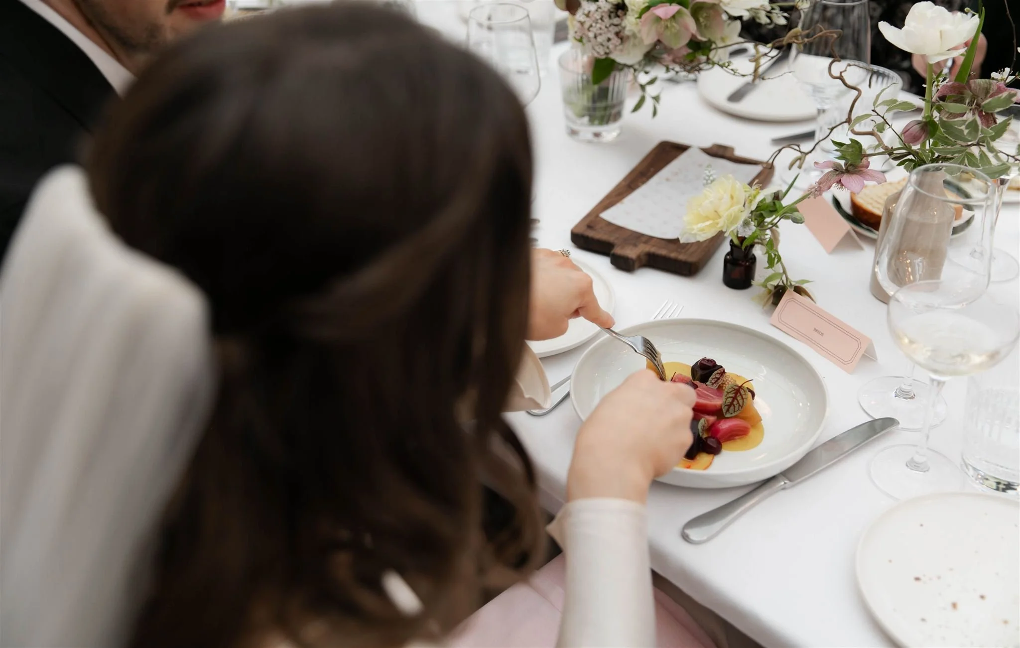 Bride eating at a reception dinner at Gleneagles Townhouse in Edinburgh following an Edinburgh City Chambers ceremony.