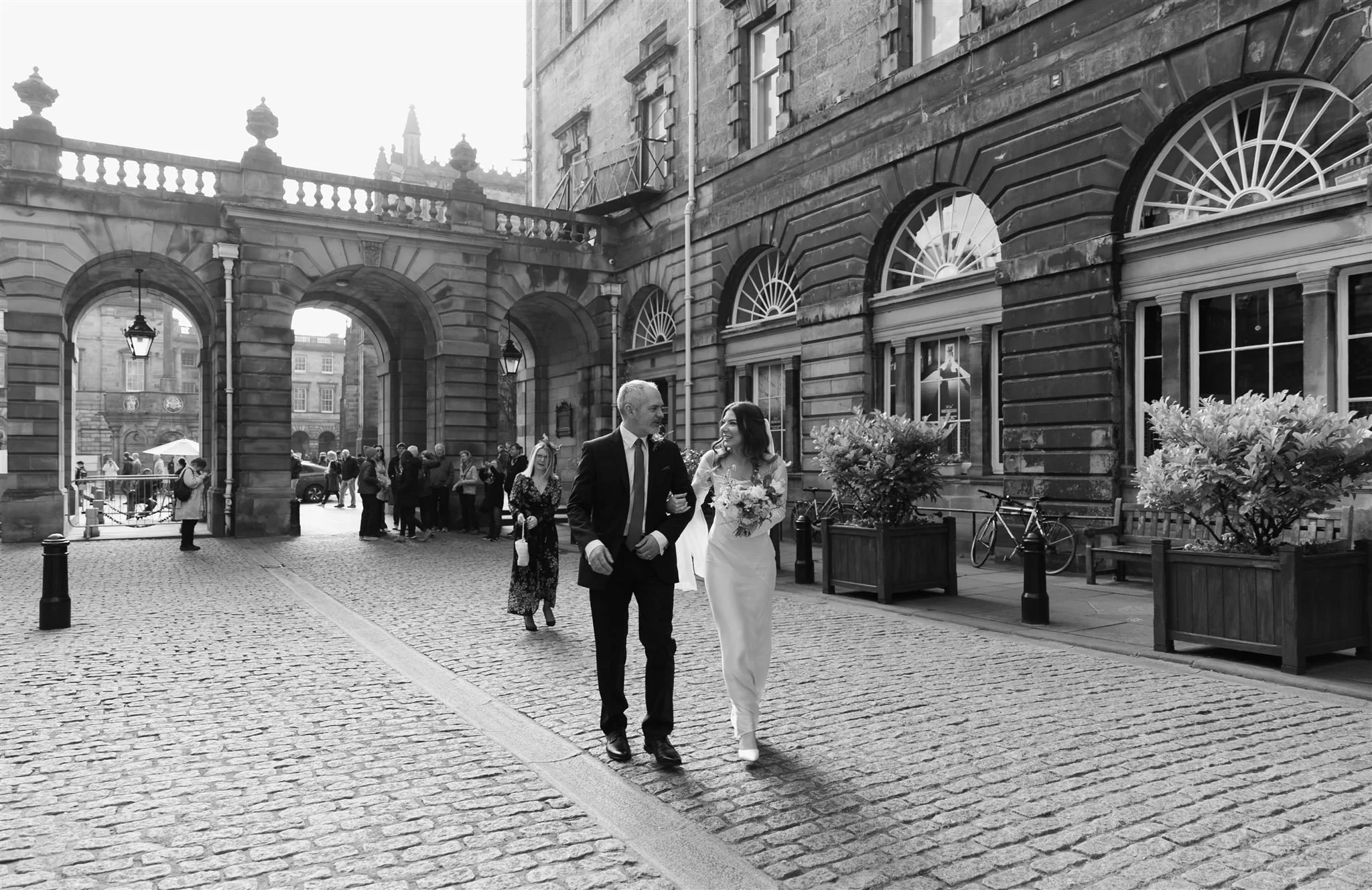 Bride and father outside Edinburgh City Chambers on a wedding day in Edinburgh.