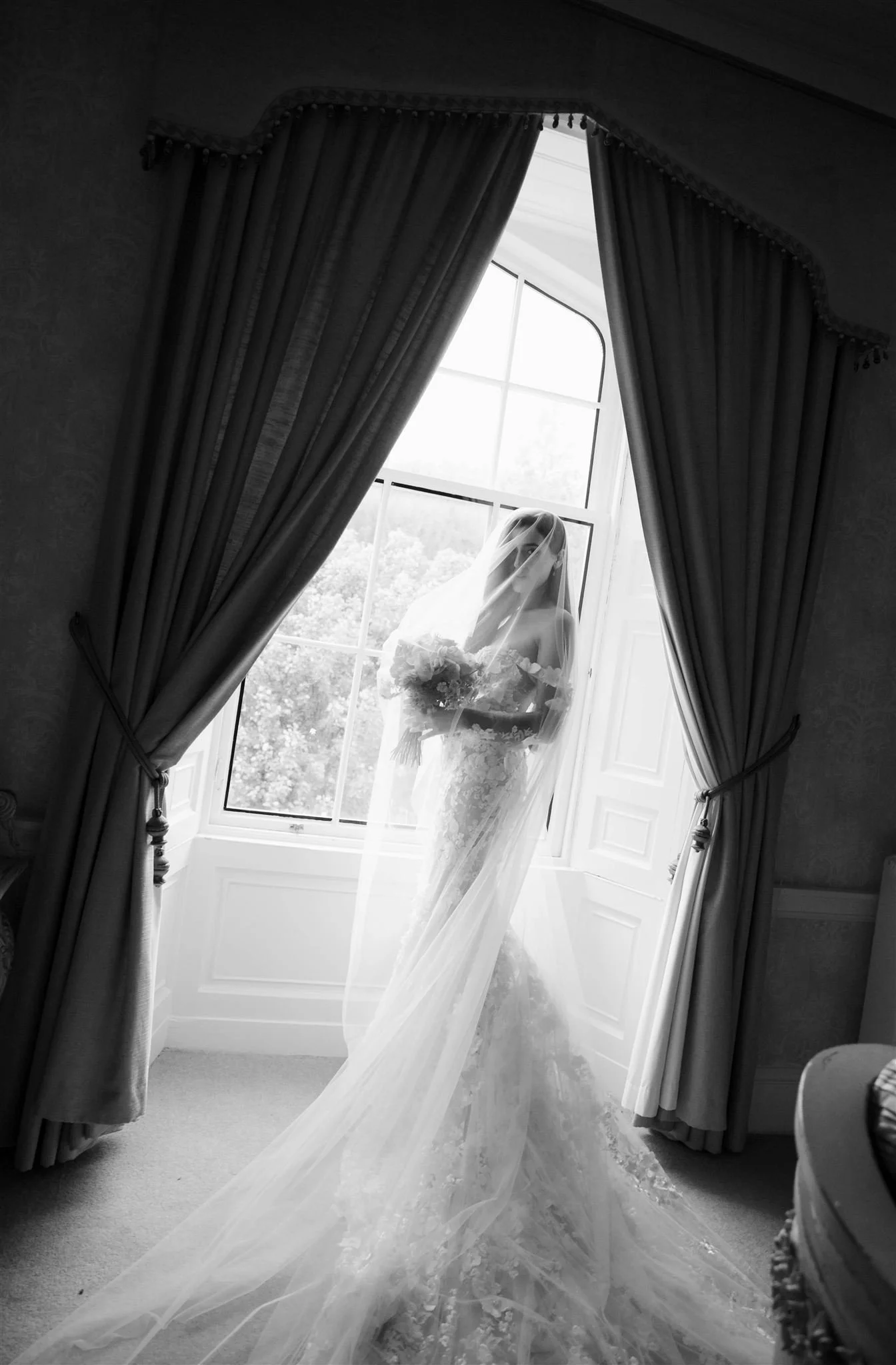 A luxury castle bride on a wedding day at Drumtochty Castle in Scotland.