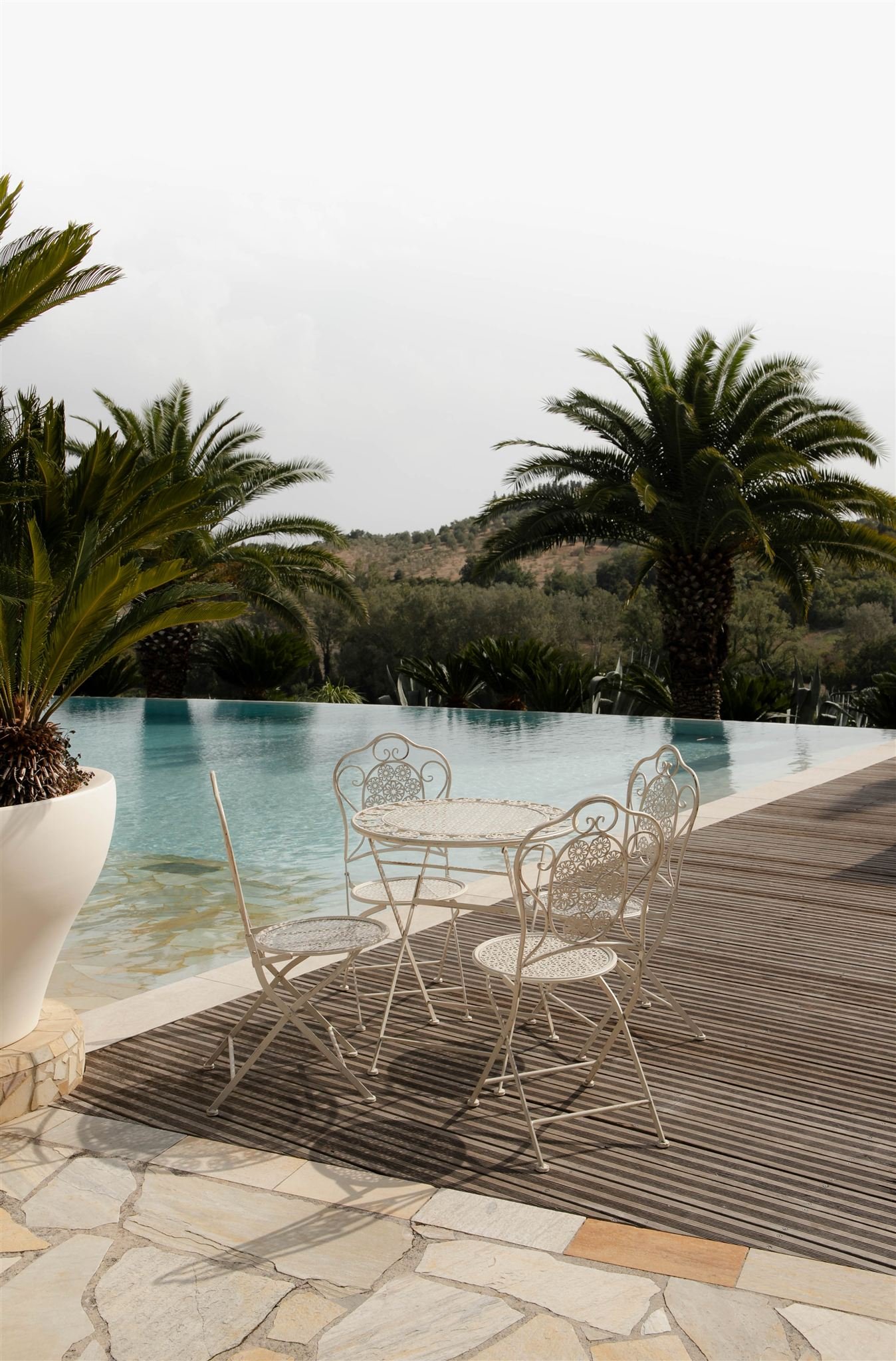 A poolside cocktail hour on a wedding day at Tenuta Corbinaia Villa in Tuscany, Italy.