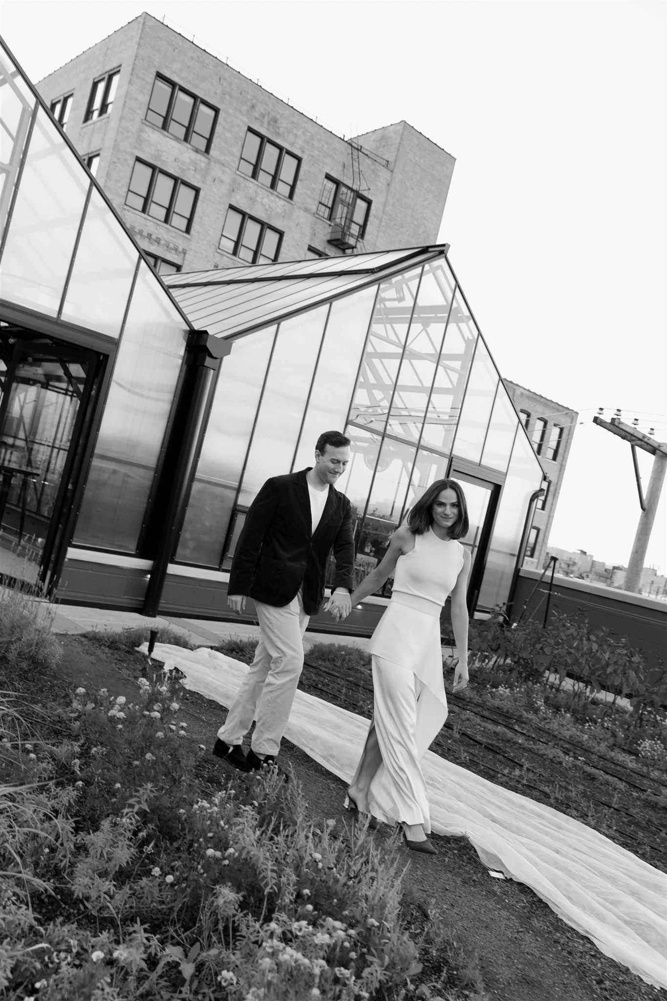 Maxwells Trading Chicago wedding rehearsal dinner with rooftop skyline portraits in downtown Chicago.