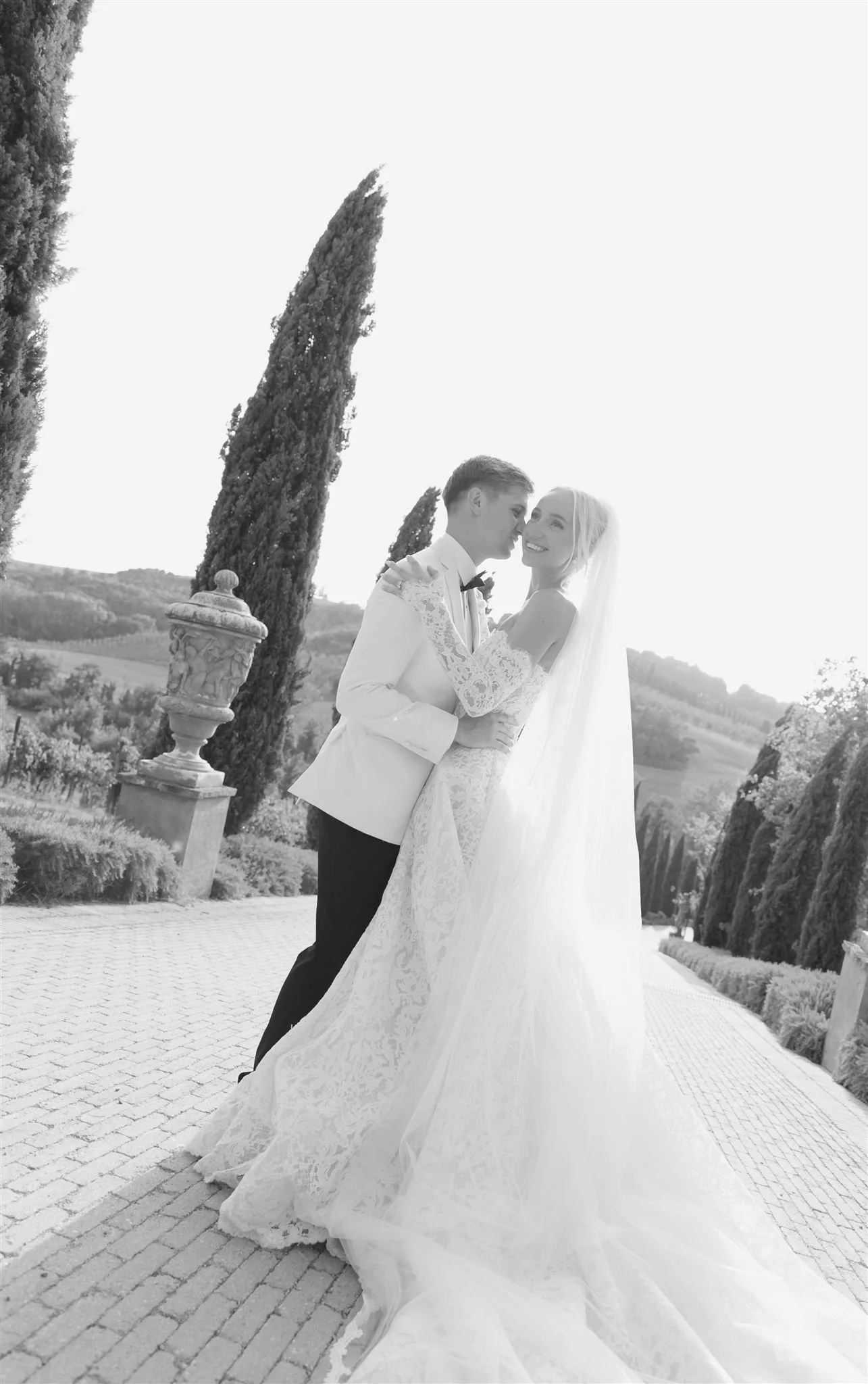 A bride and groom on a wedding day at Tenuta Corbinaia Villa in Tuscany, Italy.