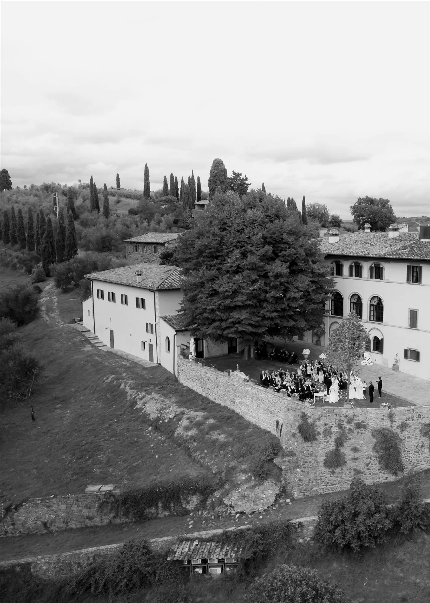 An outdoor wedding ceremony at Dievole Wine Resort in Tuscany, Italy.