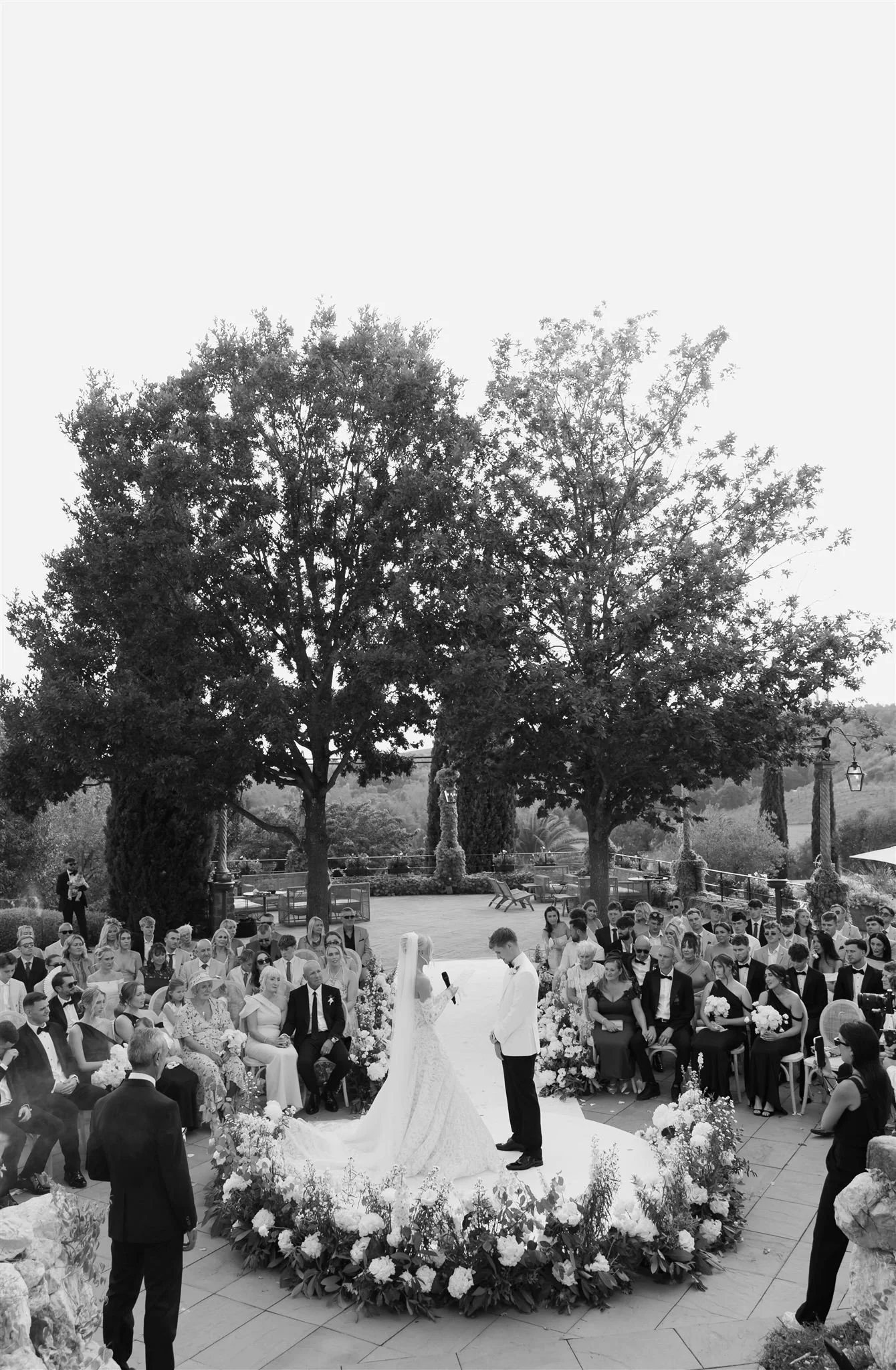 An outdoor wedding ceremony at Tenuta Corbinaia Villa in Tuscany, Italy.