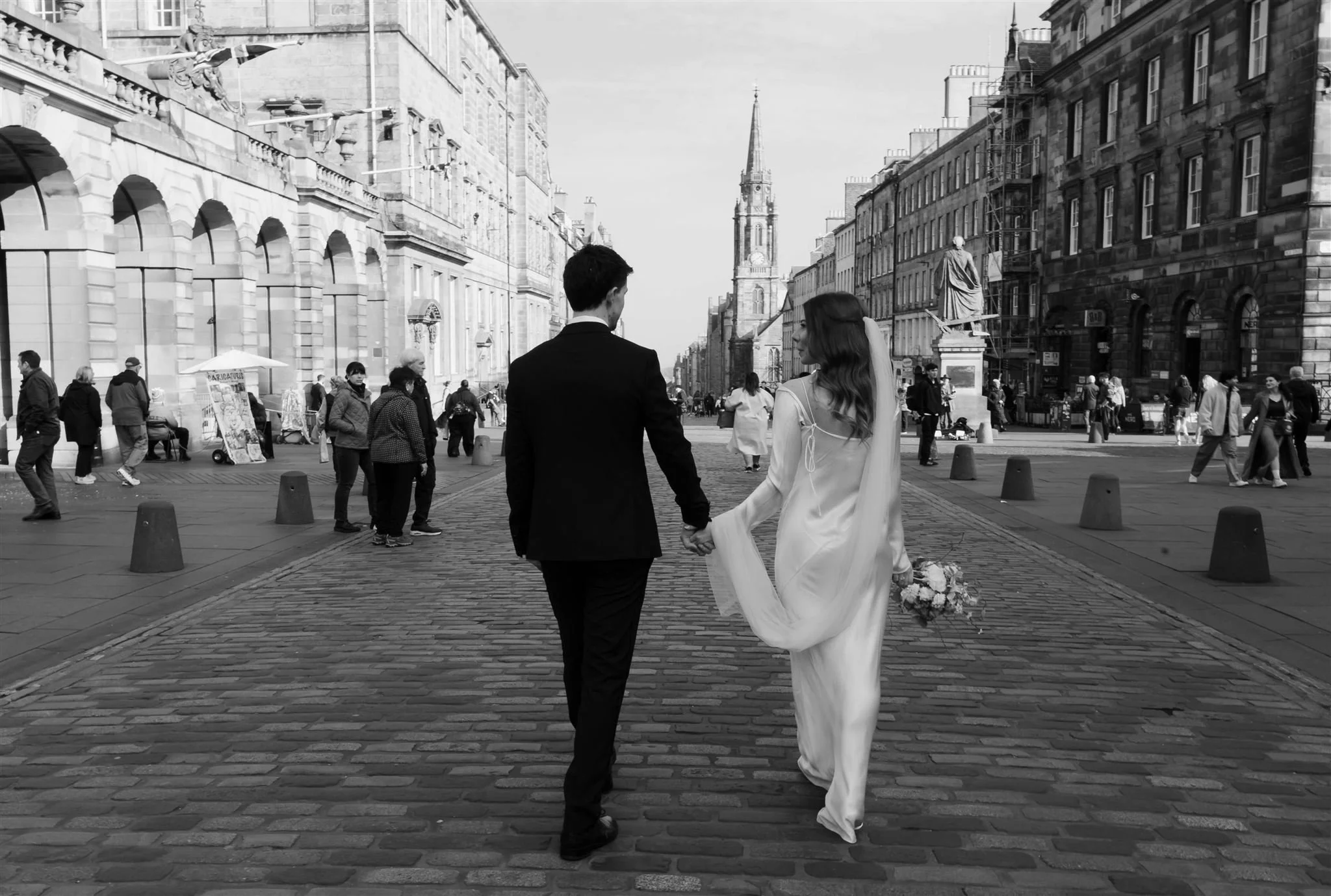 Bride and groom enjoying their wedding day outside Edinburgh City Chambers.
