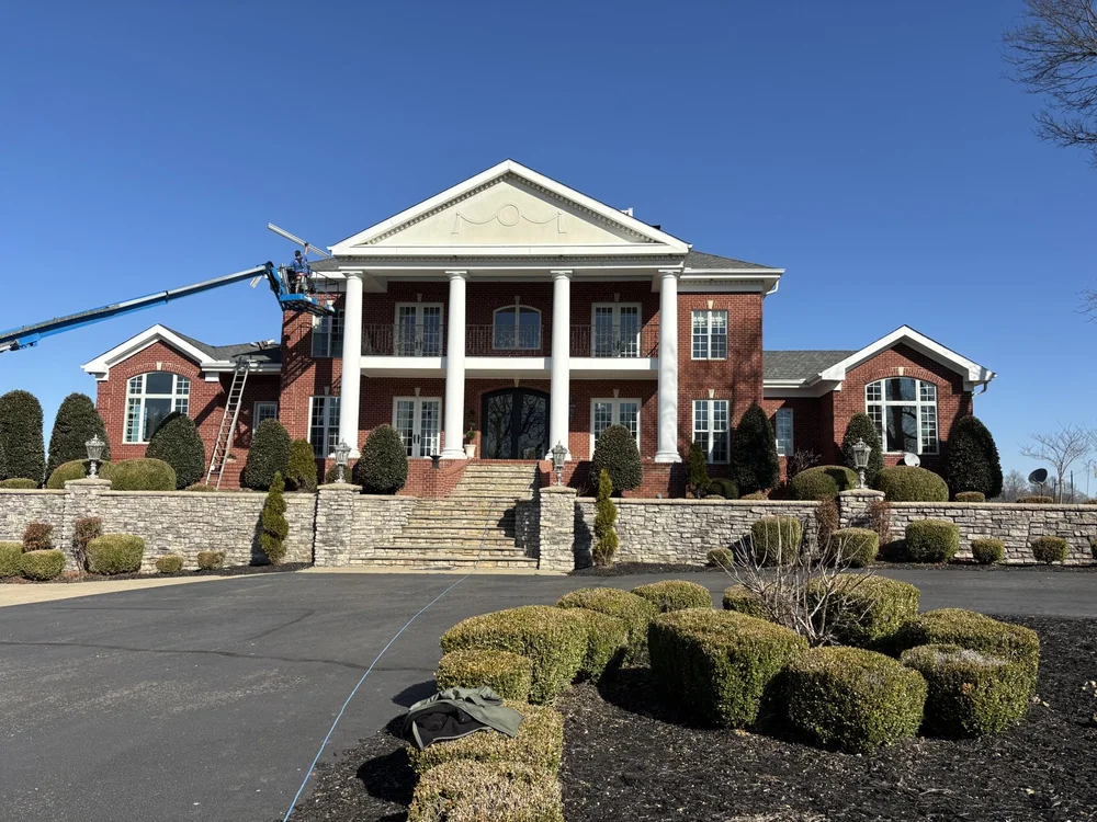 Servall gutter installation on large brick home