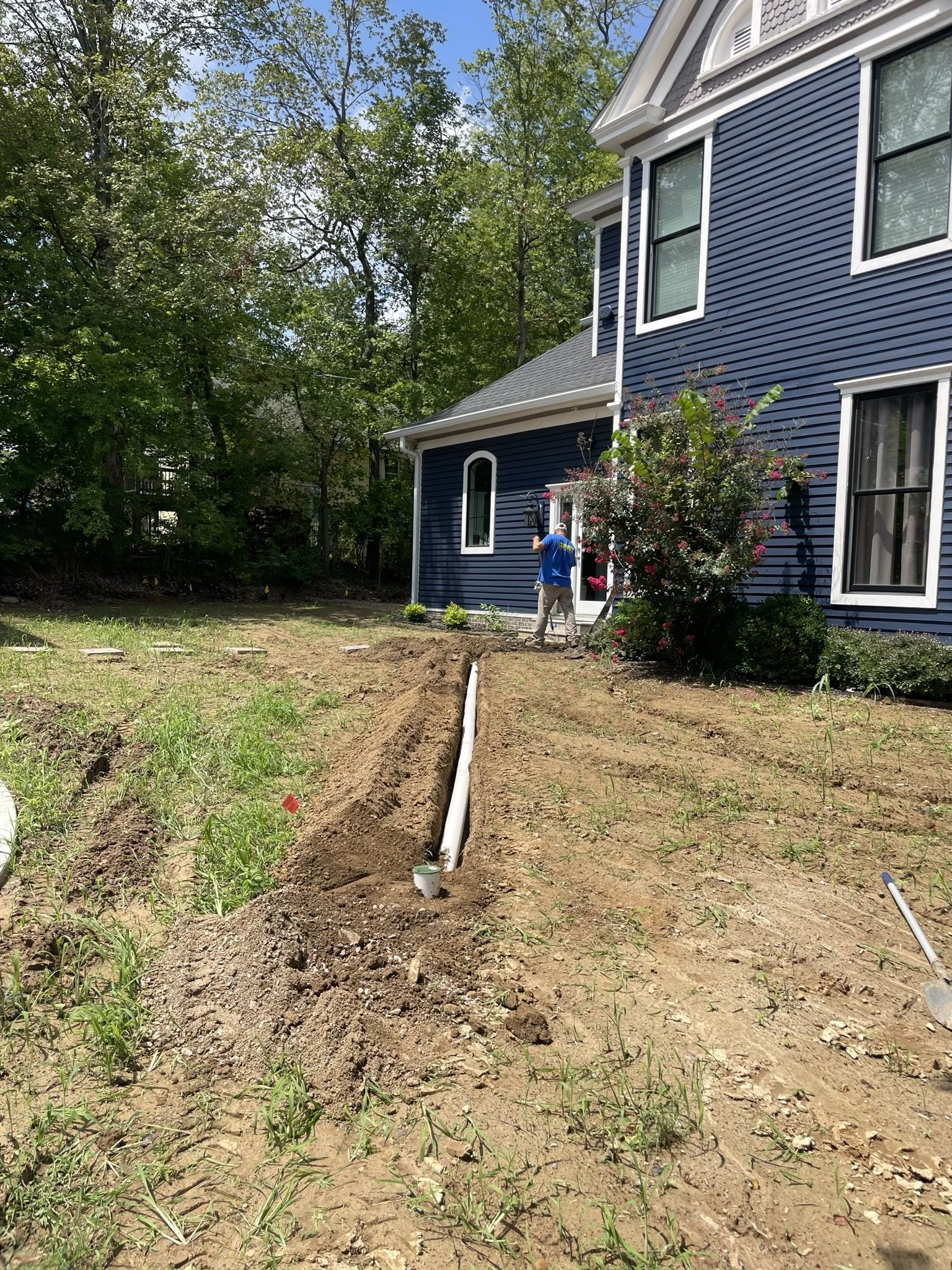 Professional underground drain installation job site
