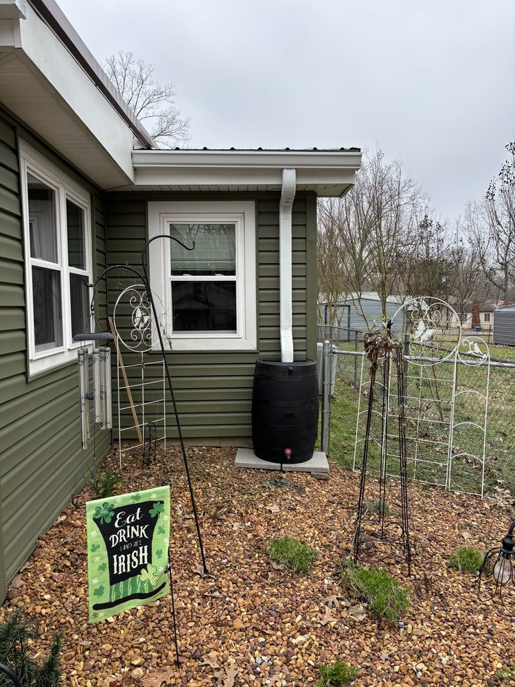 Rain barrel and gutter system by Servall Gutter Company