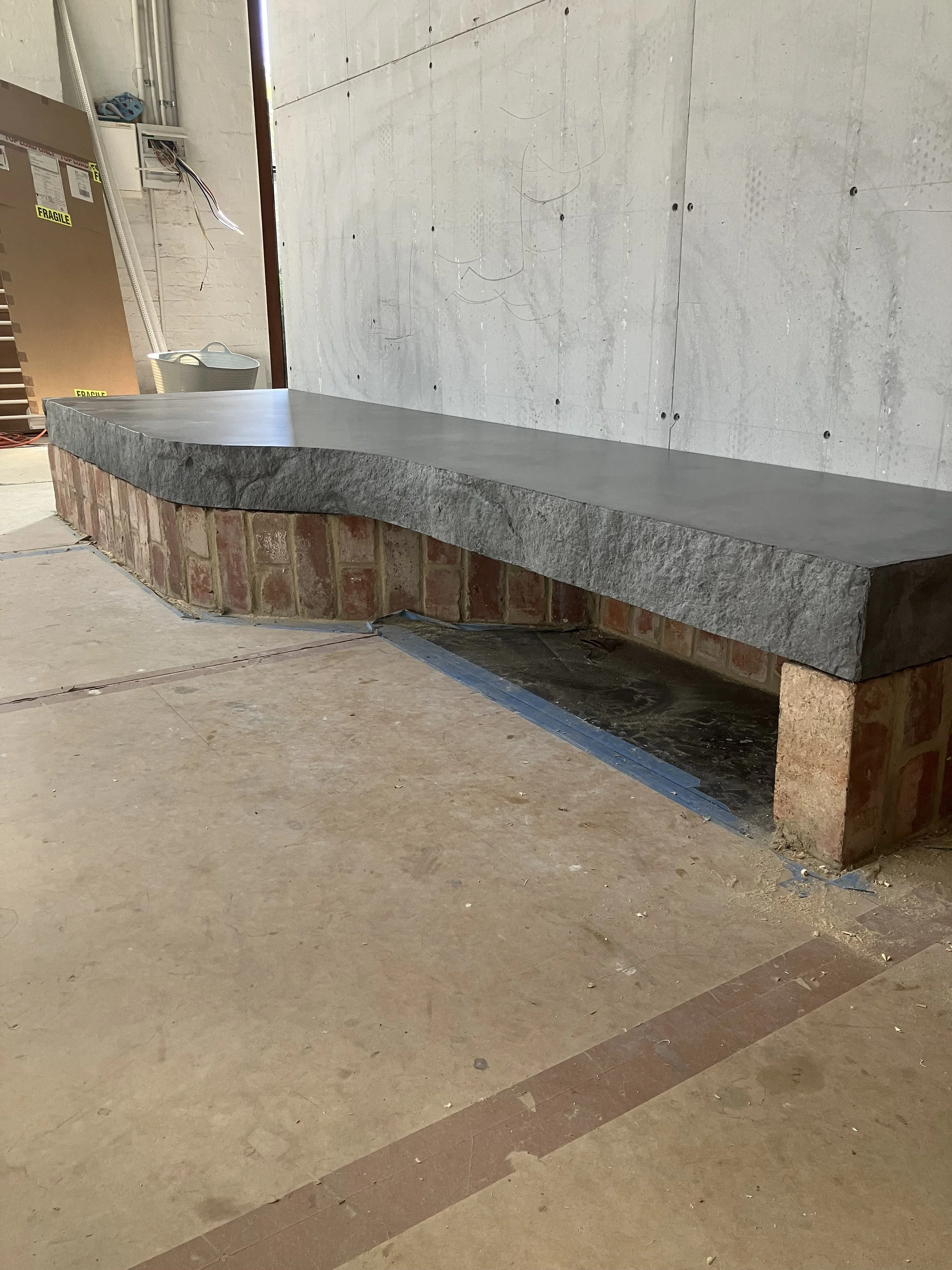 concrete-fireplace-hearth-rocky-edge.jpeg
