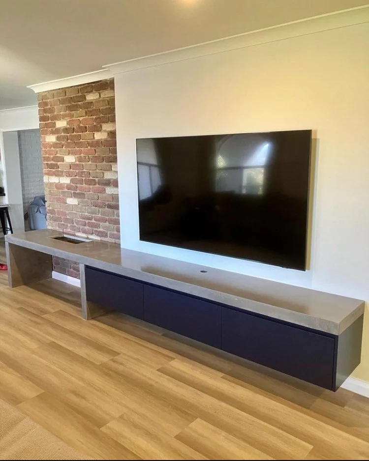 Concrete hearth detail showing sharp edges and smooth polished finish in a Melbourne project.