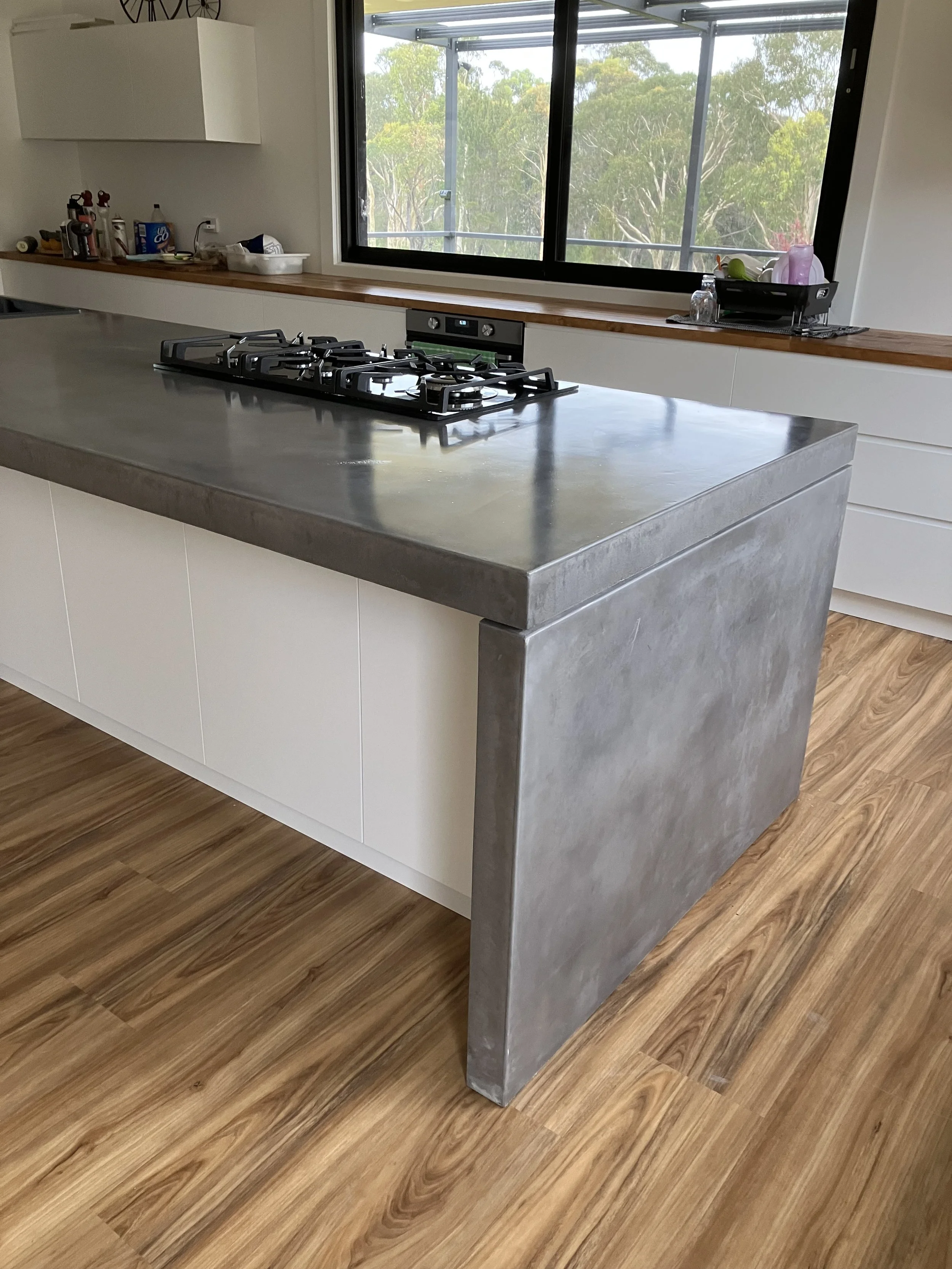 Concrete benchtop with waterfall ends and semi-gloss finish Melbourne