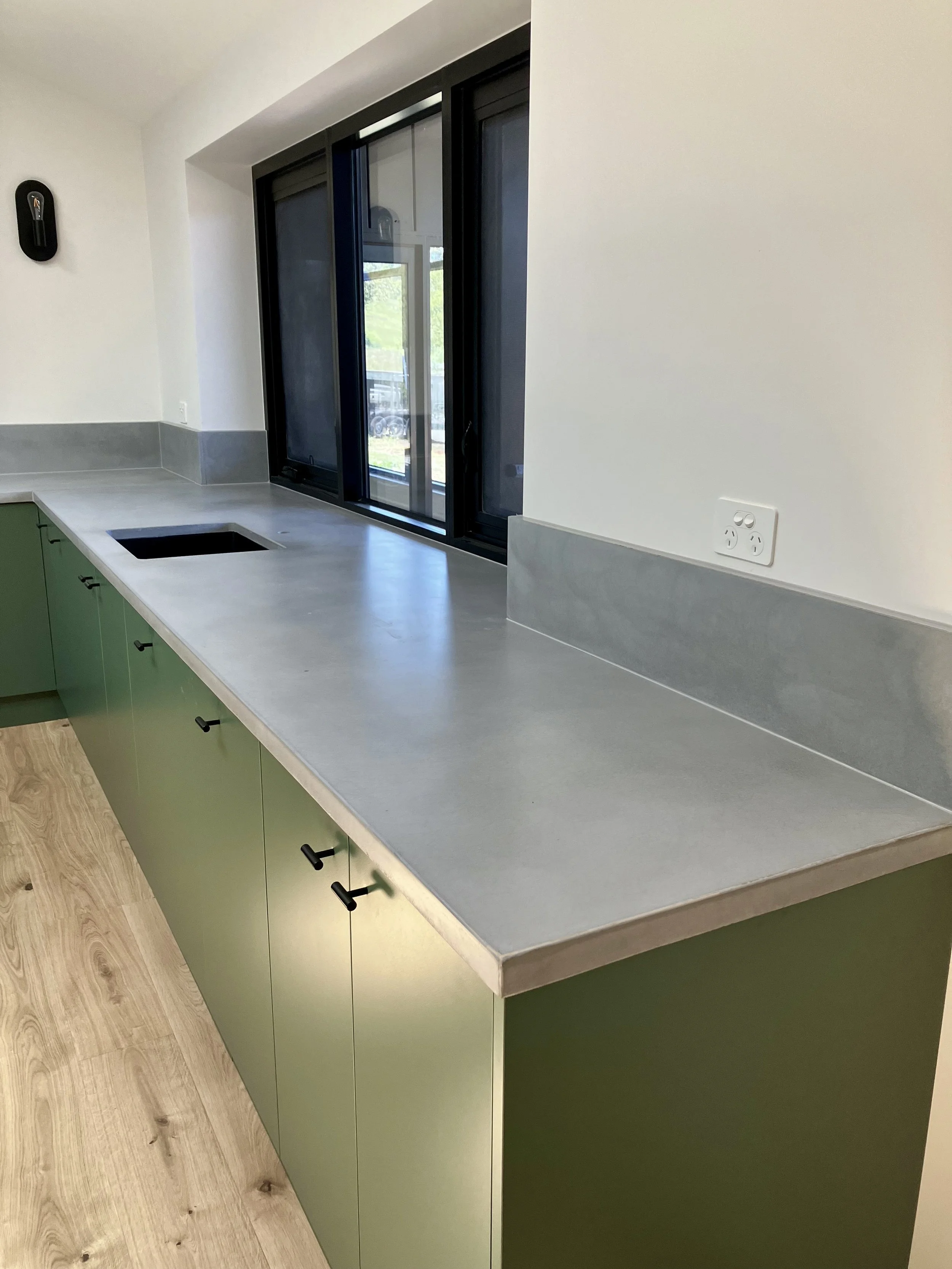 Concrete benchtop with seamless finish and splashback Melbourne