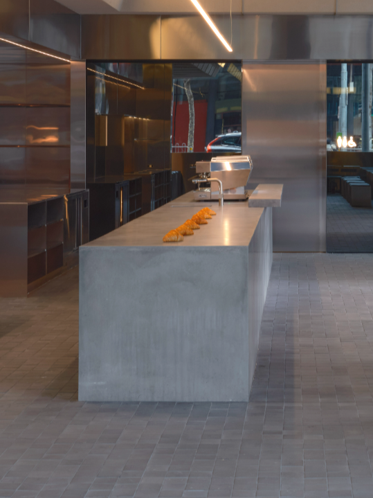 Custom Concrete Benchtops at Lune Melbourne commercial fitout with seamless polished finish