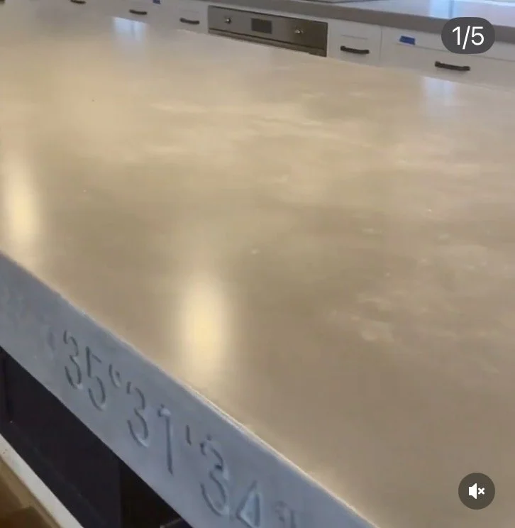 Polished concrete benchtop detail showing smooth finish and natural texture