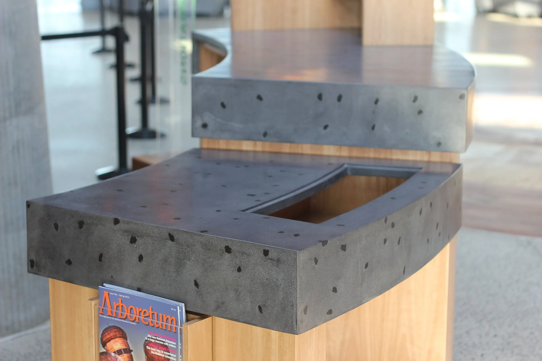 Commercial concrete benchtop with bar seating and polished finish Melbourne fitout

