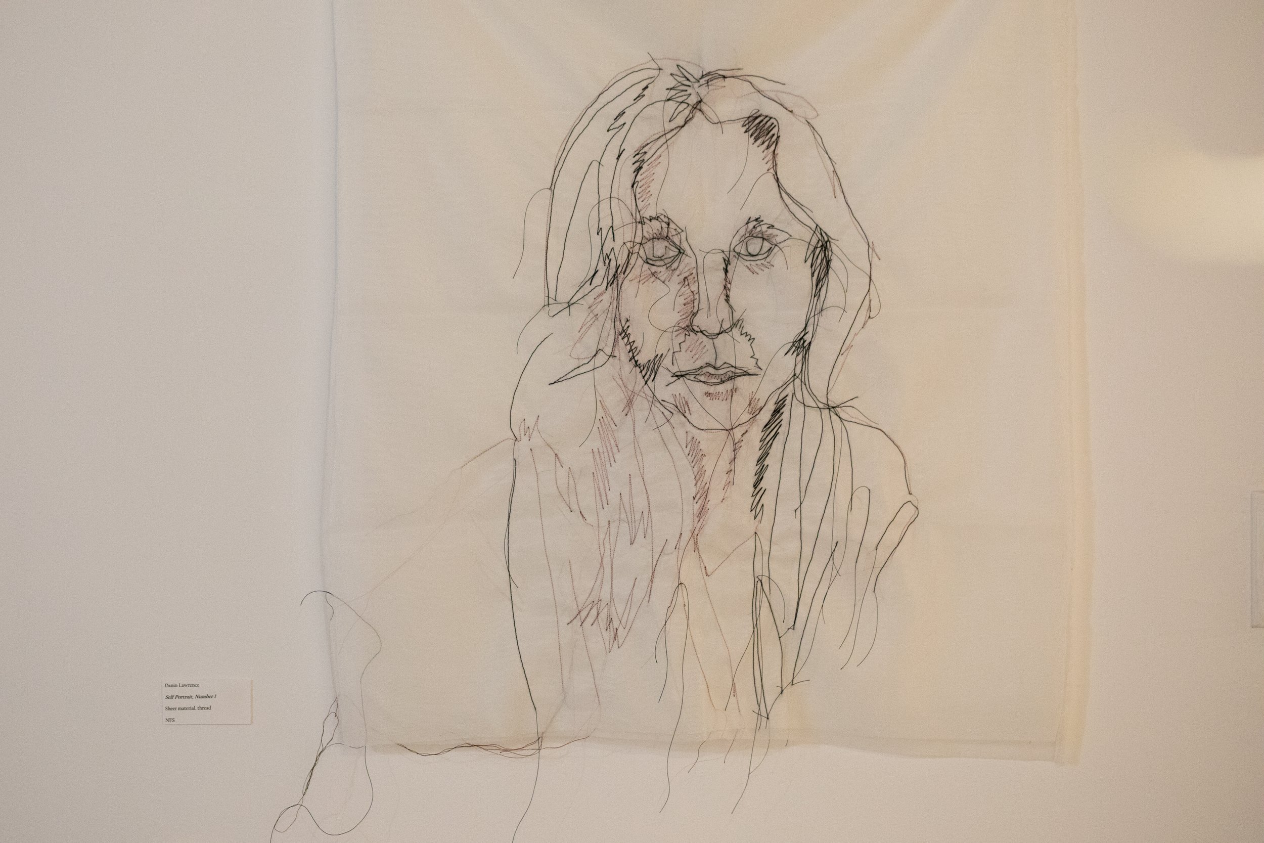 SELF PORTRAIT. Found fabric, thread.