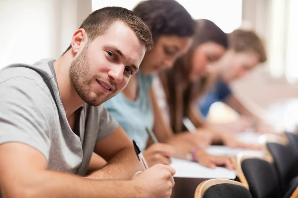 person studying alongside others but independently
