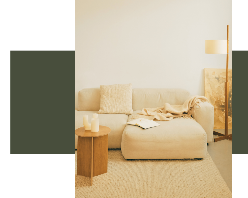 Calm, contemporary therapy space with a cream sofa, representing virtual somatic therapy sessions for women in New York City.