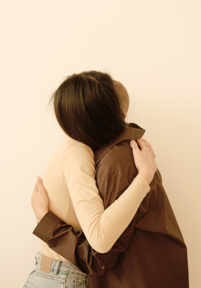 Two women embracing, representing somatic therapy for relationship patterns and connection for women in New York City.