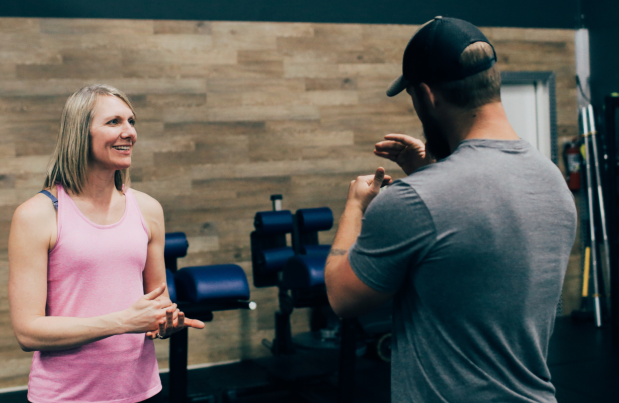 Prospective OPEX CDA member speaking with a coach about her goals.