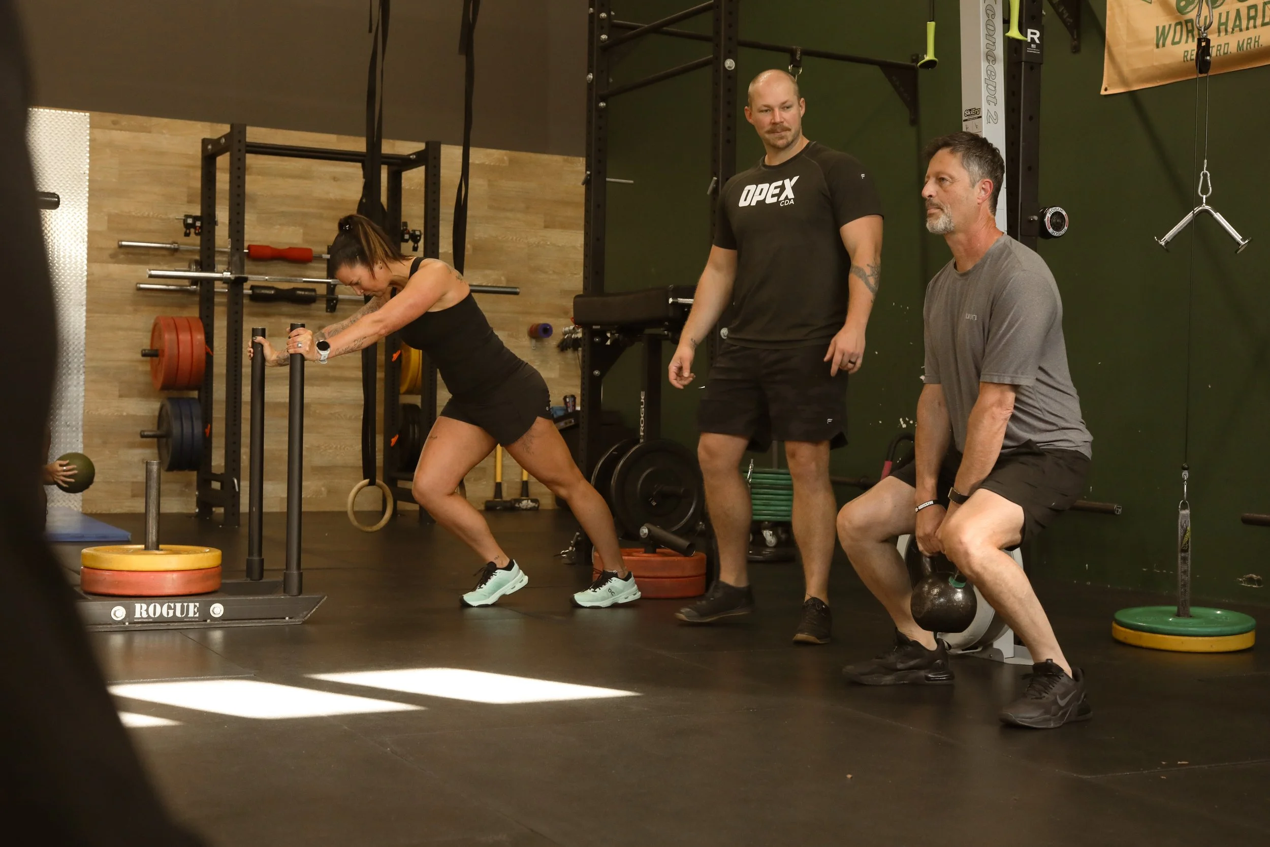 OPEX CDA members following individualized workouts with guidance from their coach