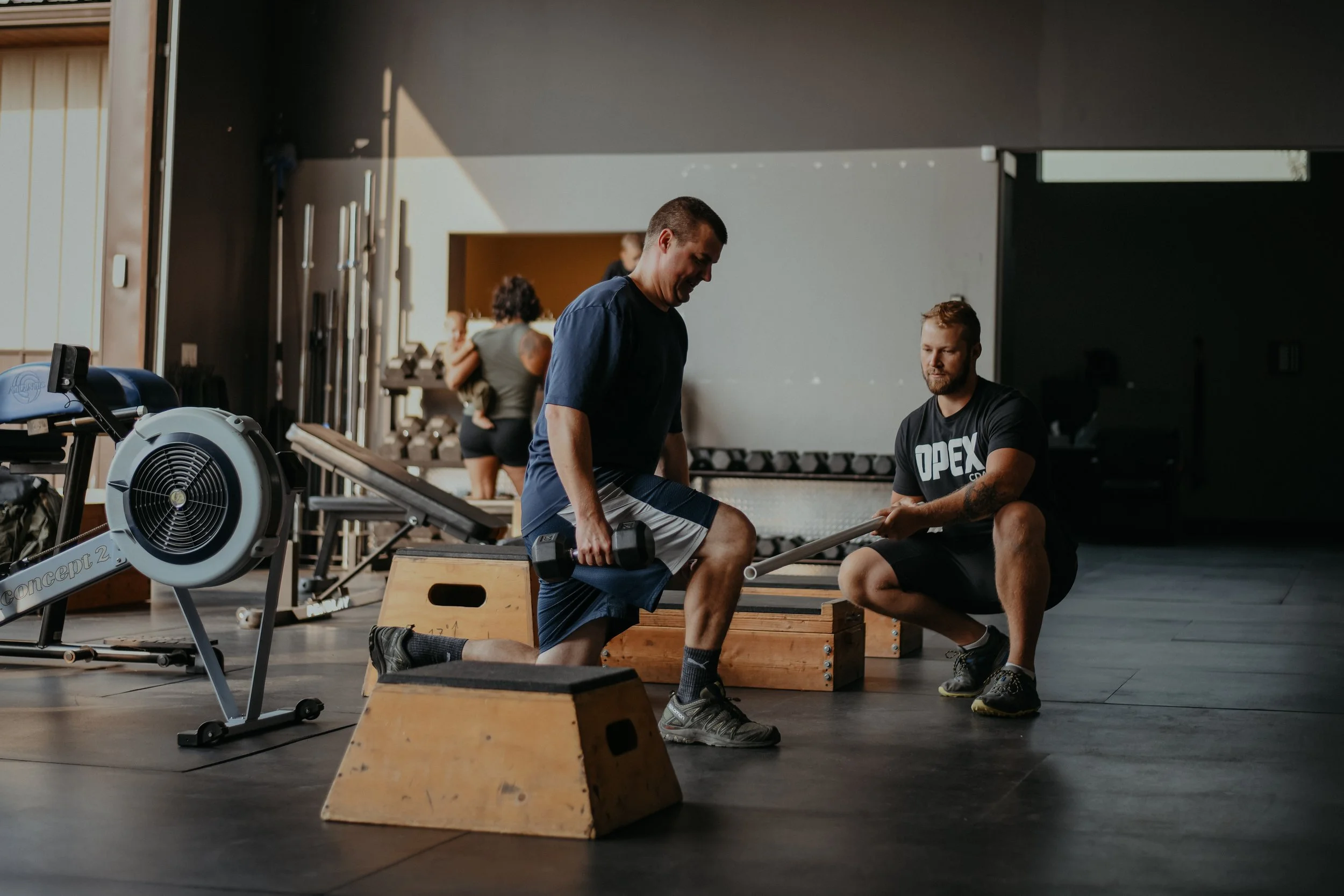 OPEX CDA coach guiding a member through his individualized training plan.