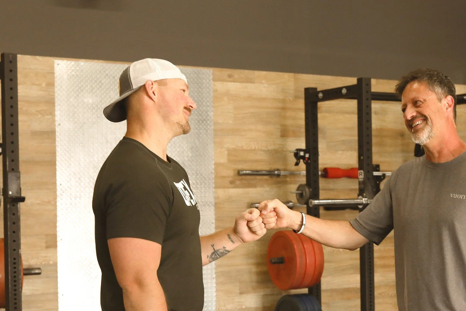 OPEX CDA coach Brandon celebrating a member’s progress through individualized fitness coaching