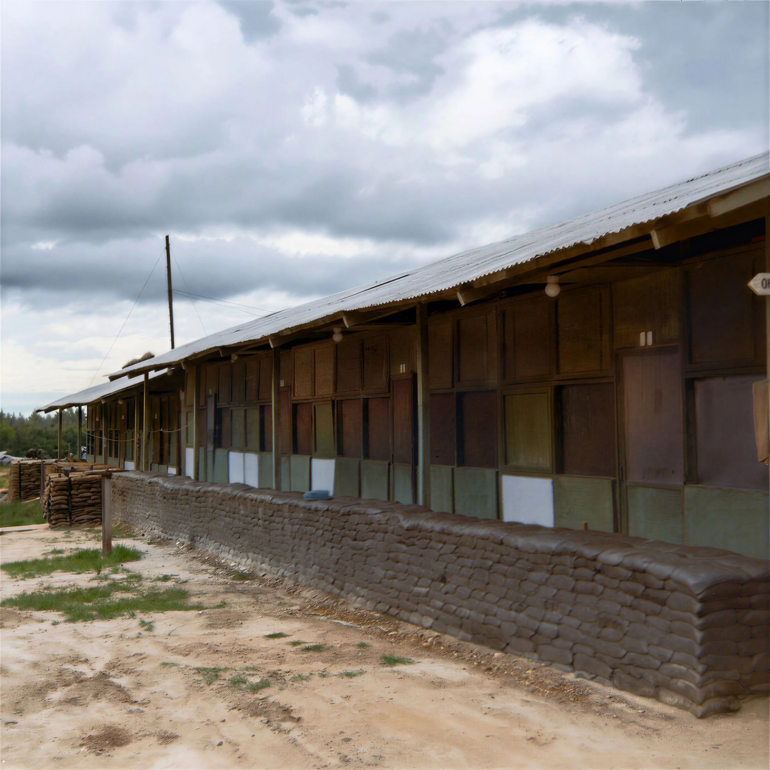 In his own handwriting Joe described a 3x3 snapshot that was sent back to NJ, “this is where I lived in Phu Bai”, a combat base in central Vietnam. These simple barracks were known as “hooches” to the soldiers serving in Vietnam. They were thin-walle