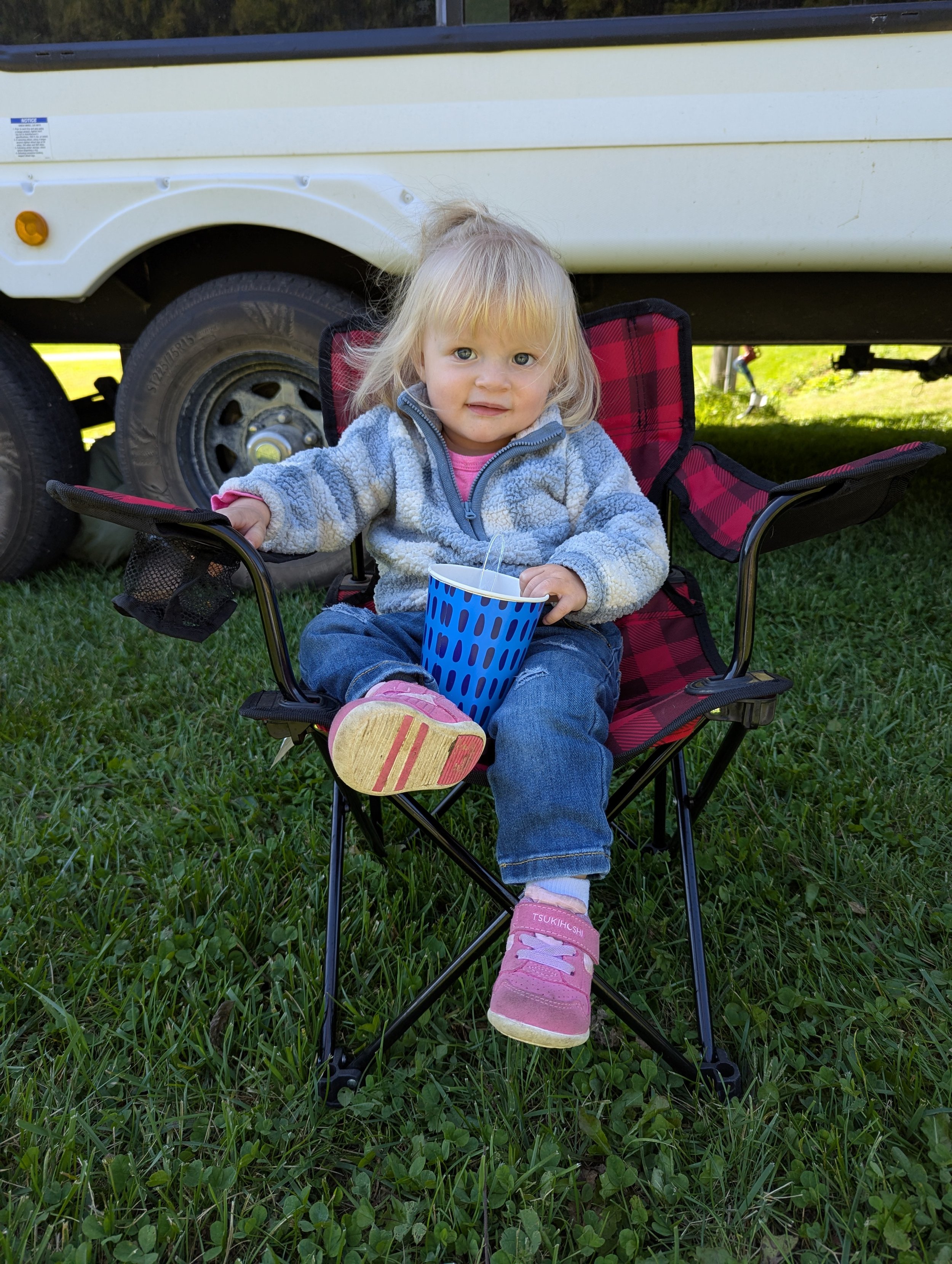 Little girl in camping chair