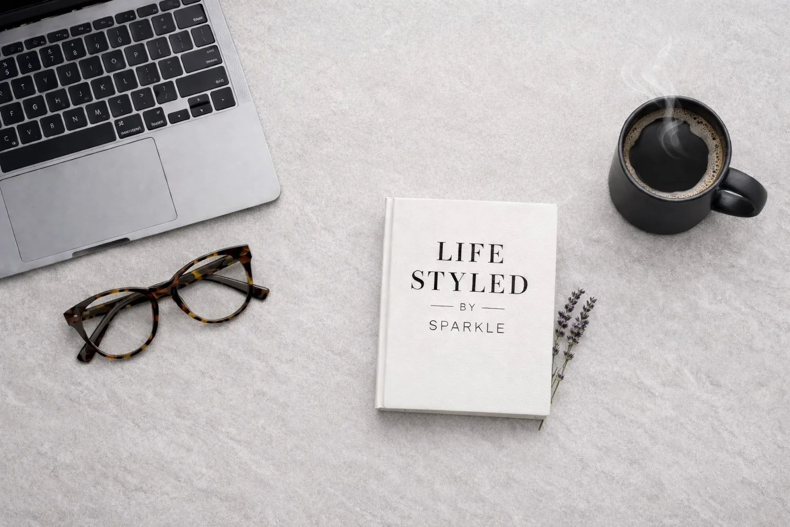 Minimalist workspace with a mood board and laptop for intentional building and transition rituals.