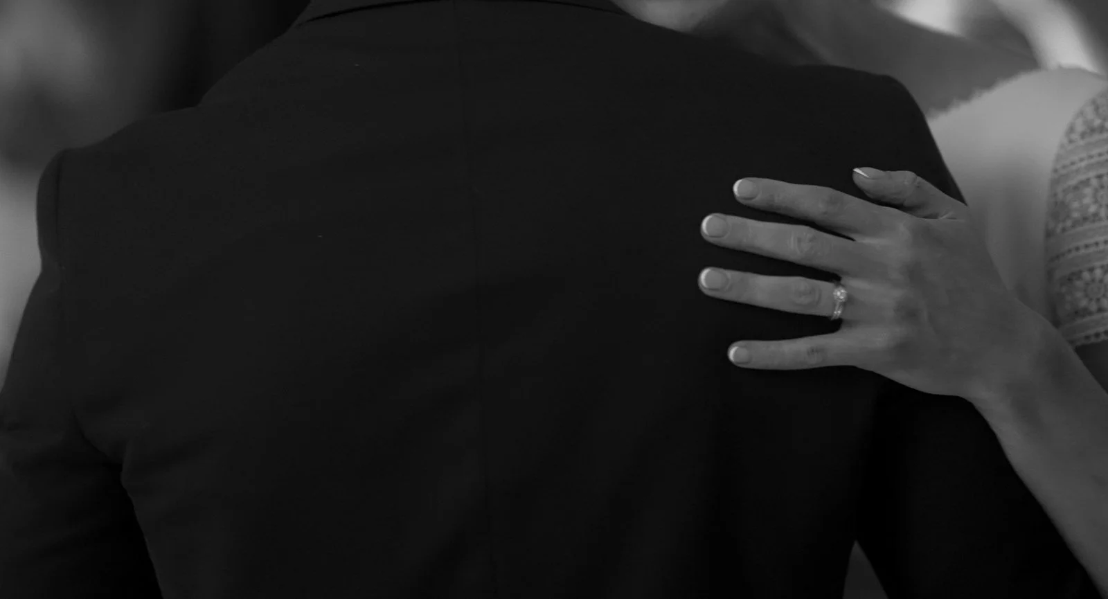 Couple dancing on their wedding at Gileston Manor with a close up of the brides wedding ring
